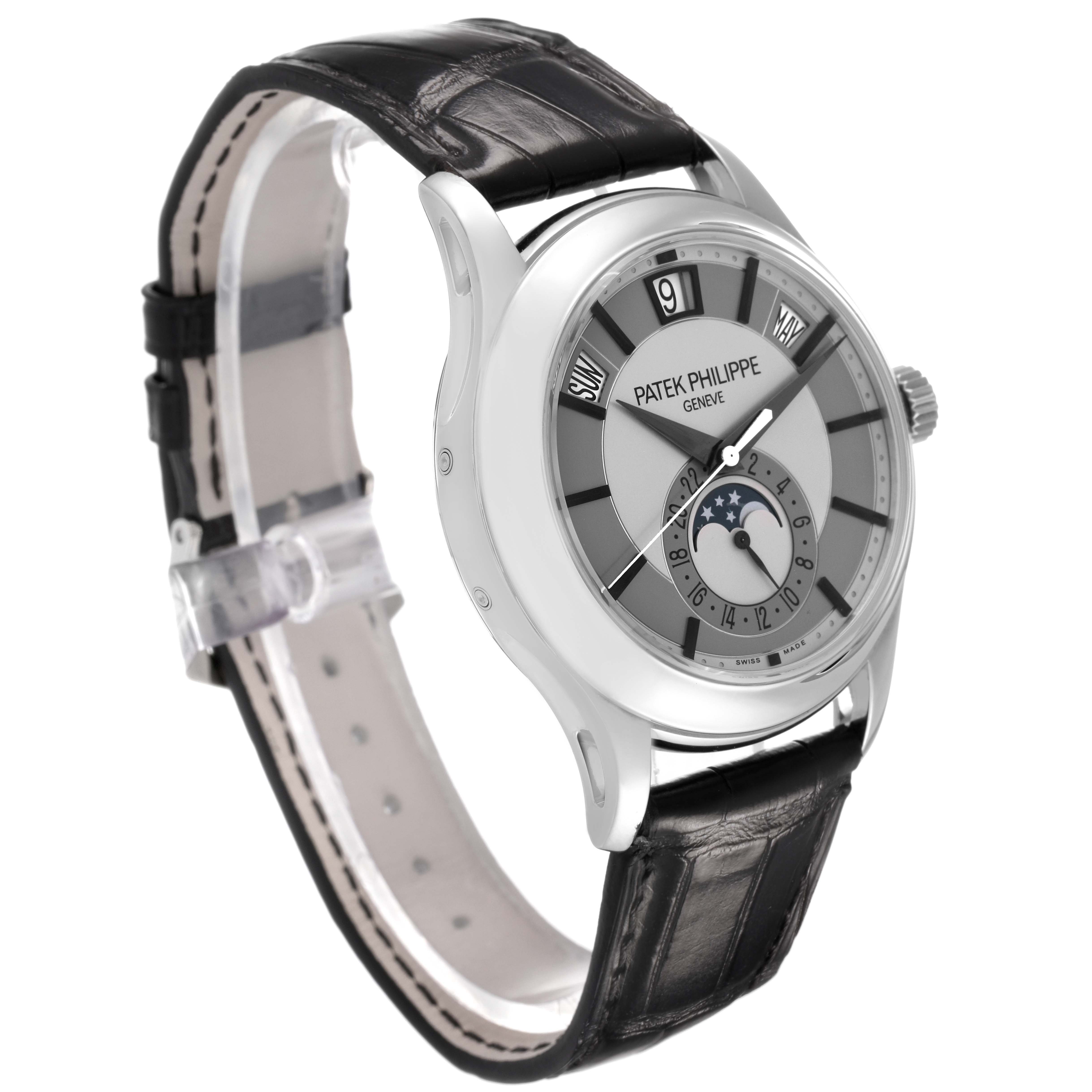 The Patek Philippe Complications 5205G-001 Men's White Gold Silver Dial watch is shown at a 3/4 angle, highlighting the dial, leather strap, and side crown.