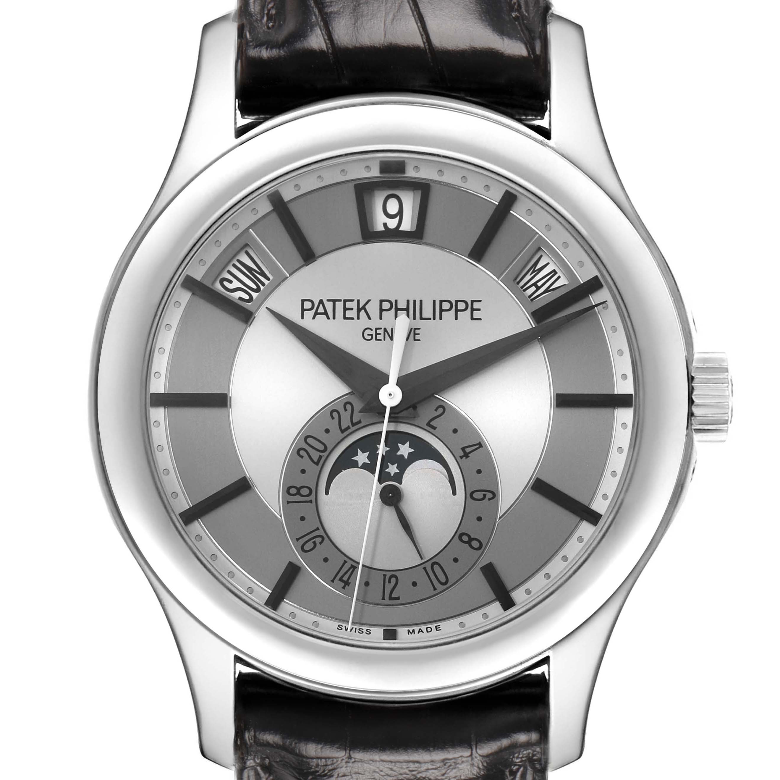 The image shows a front view of the Patek Philippe Complications 5205G-001 Men's White Gold Silver Dial watch, highlighting the dial, hands, and moon phase display.