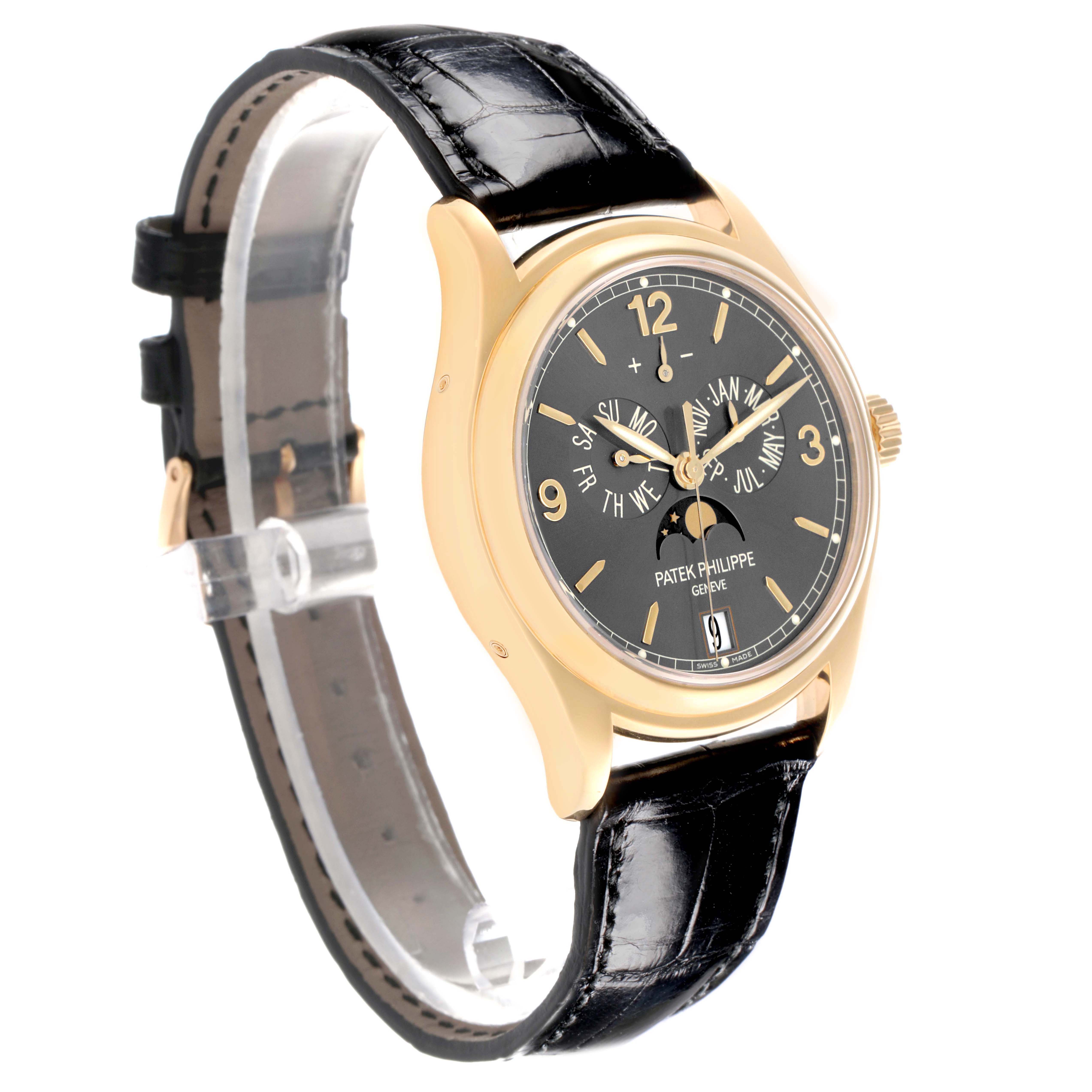The Patek Philippe Complications 5146J-010 Men's Yellow Gold Grey Dial watch is shown at a three-quarter angle, displaying the face, gold case, and black leather strap.