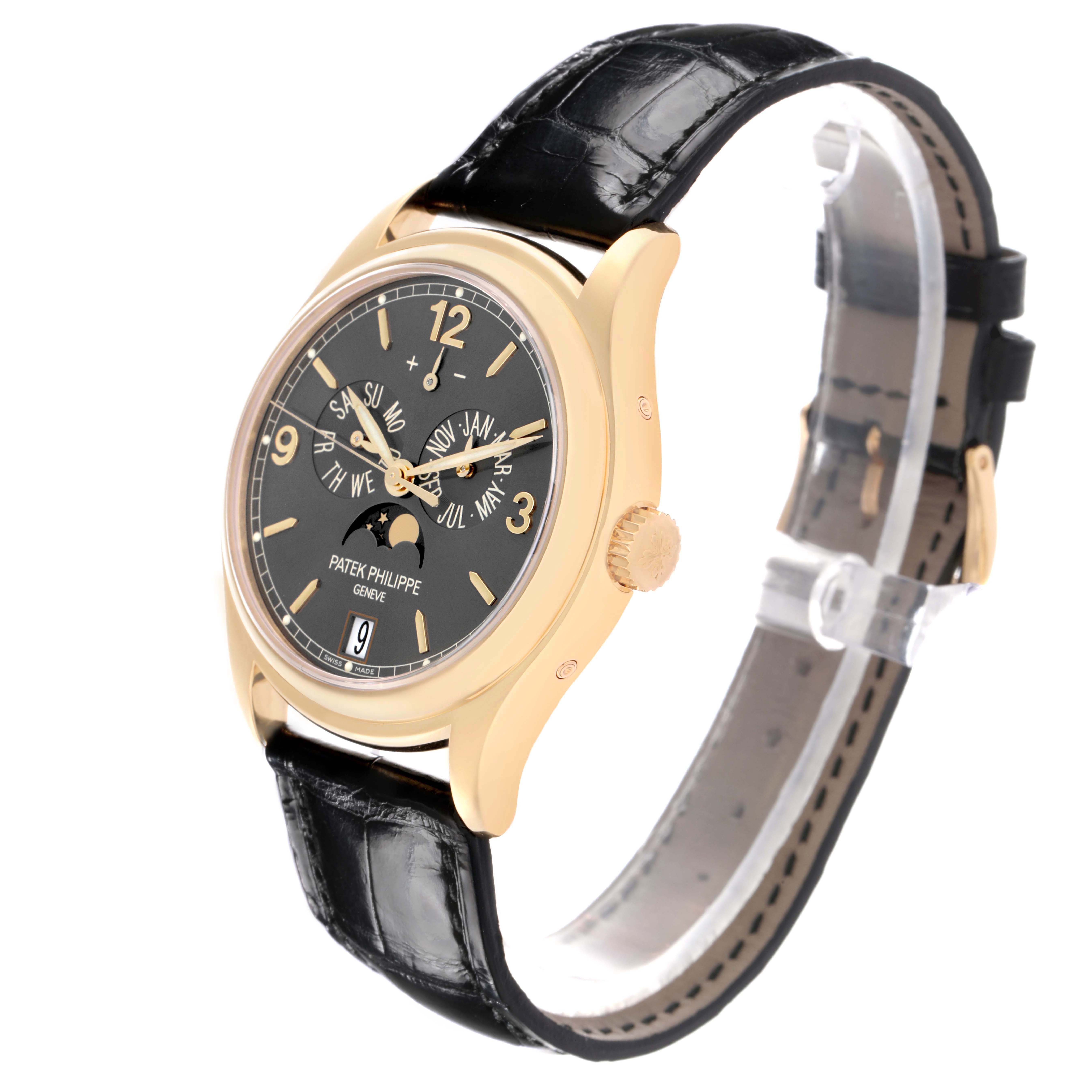 The Patek Philippe Complications 5146J-010 Men's Yellow Gold Grey Dial watch is shown at a slight side angle, highlighting the black dial and leather strap.