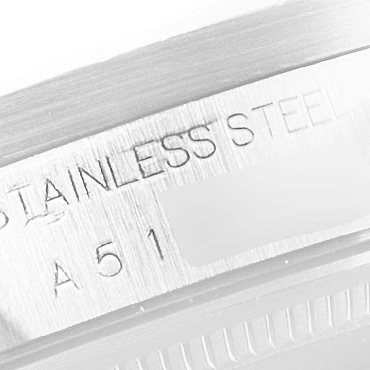 This close-up image of the Rolex Air-King 14010 Men's Stainless Steel Black Dial 14010 Men's Stainless Steel Black Dial watch shows its stainless steel case with engraved details.