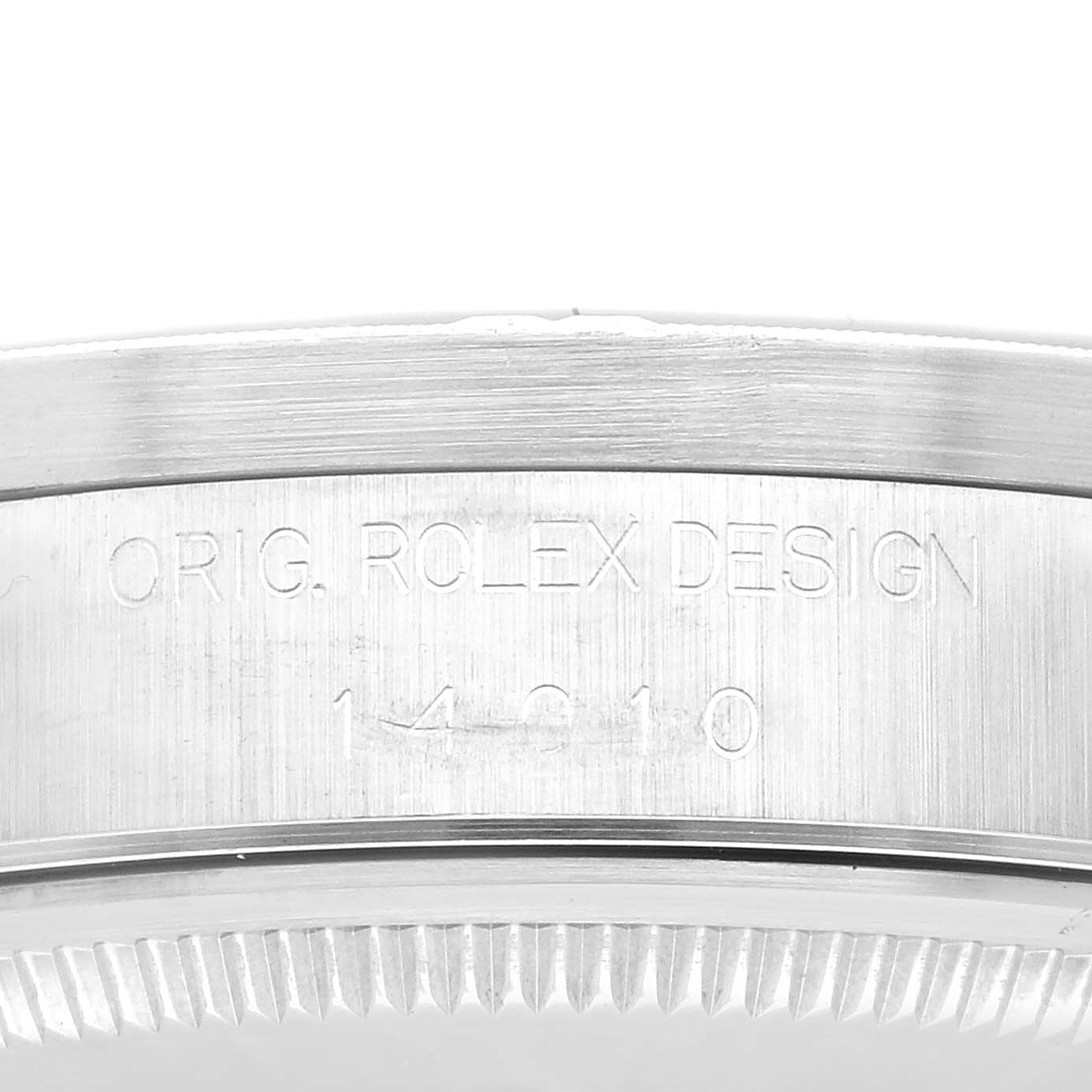 The image shows the side view of the bezel and case side of a Rolex Air-King 14010 Men's Stainless Steel Black Dial 14010 Men's Stainless Steel Black Dial watch, featuring engraved details.