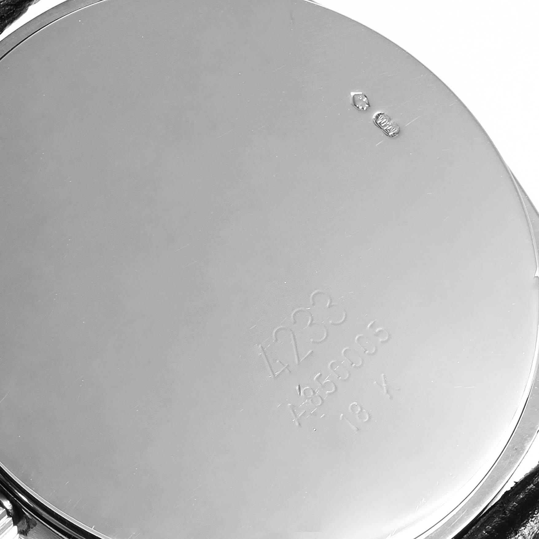 The image shows the case back of a Rolex Cellini 4233 Men
s White Gold White Dial 4233 Men
s White Gold White Dial watch, displaying engravings and hallmarks.