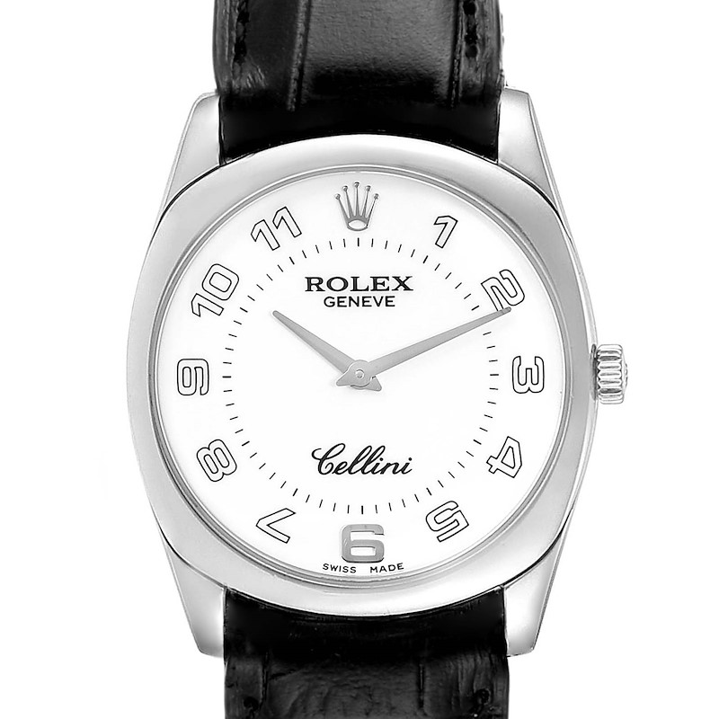 The image shows a front view of a Rolex Cellini watch, focusing on its white dial, numerals, and black leather strap.