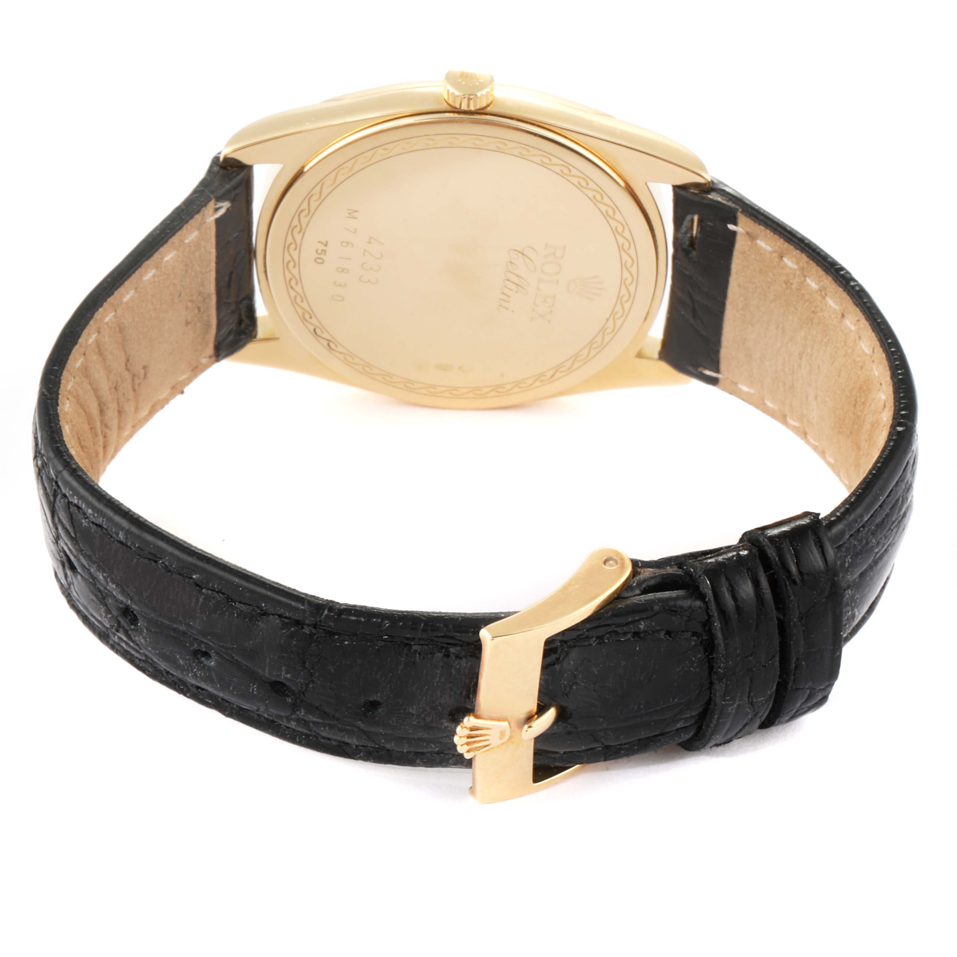 The image shows the back case and black leather strap with a gold buckle of a Rolex Cellini 4233 Men's Yellow Gold Black Dial 4233 Men's Yellow Gold Black Dial watch.