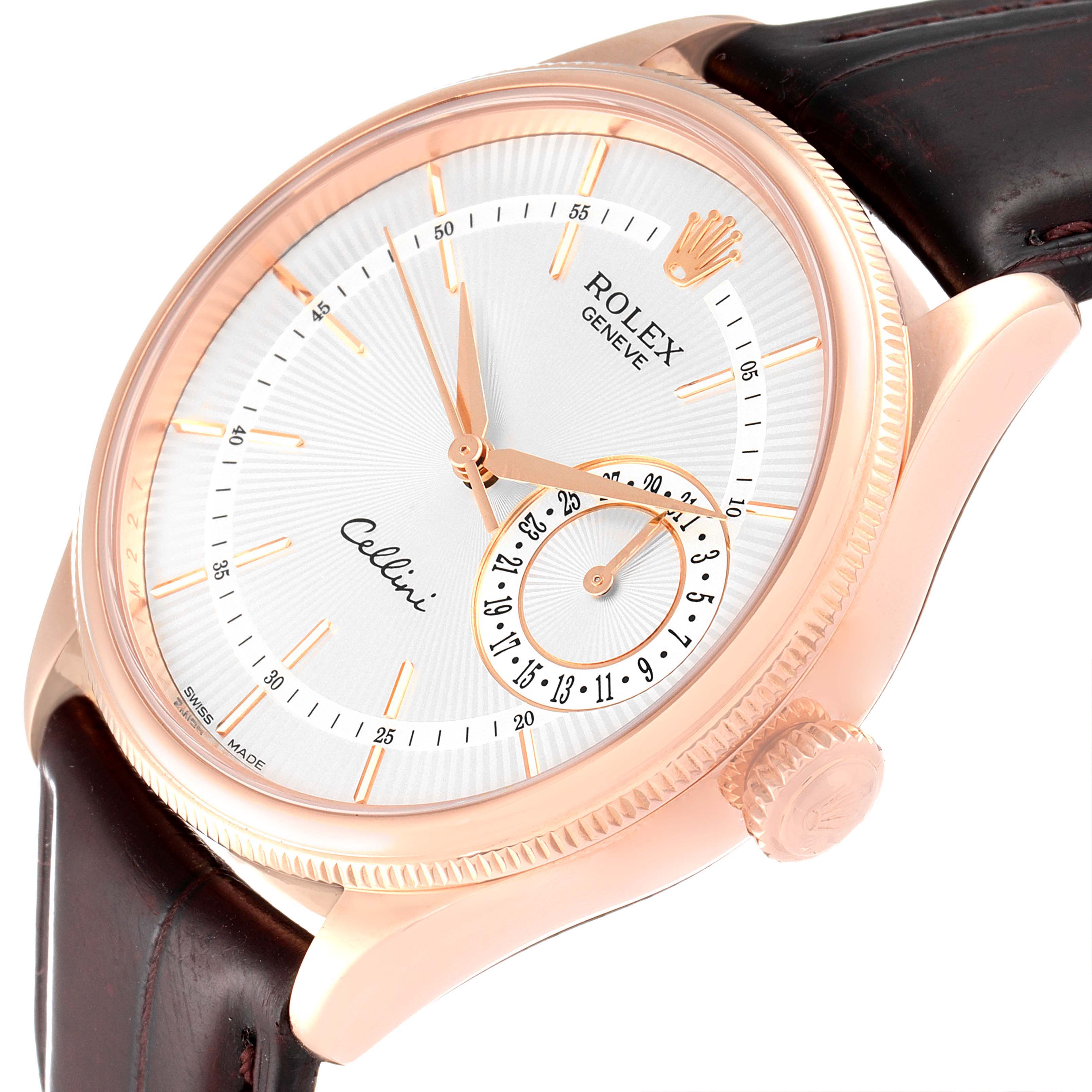 The Rolex Cellini 50515 Men's Rose Gold Silver Dial 50515 Men's Rose Gold Silver Dial watch is shown from a front-side angle, highlighting its face, crown, and leather strap.