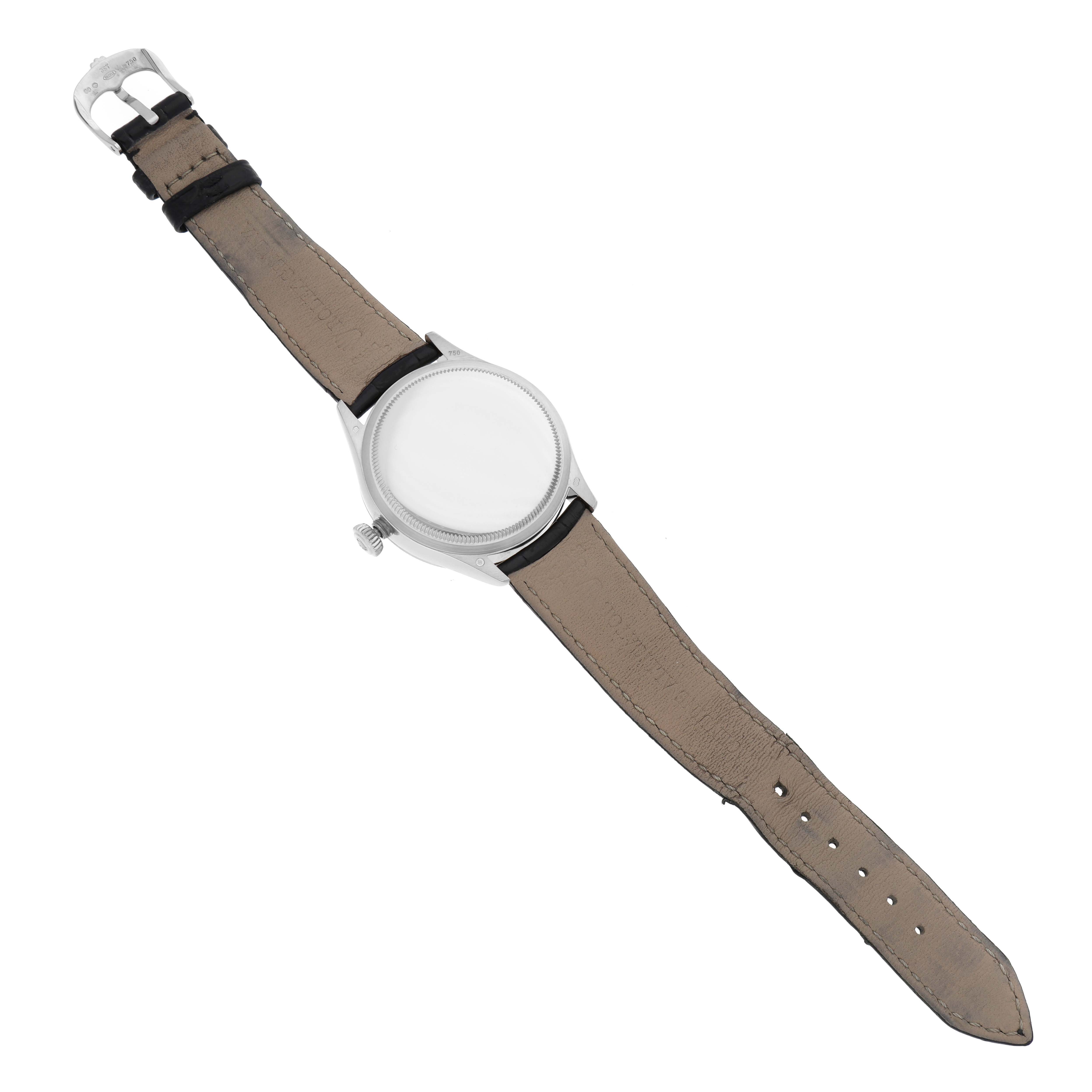 The Rolex Cellini 50529 Men's White Gold Silver Dial 50529 Men's White Gold Silver Dial watch is shown from the back, displaying its strap, buckle, and caseback.