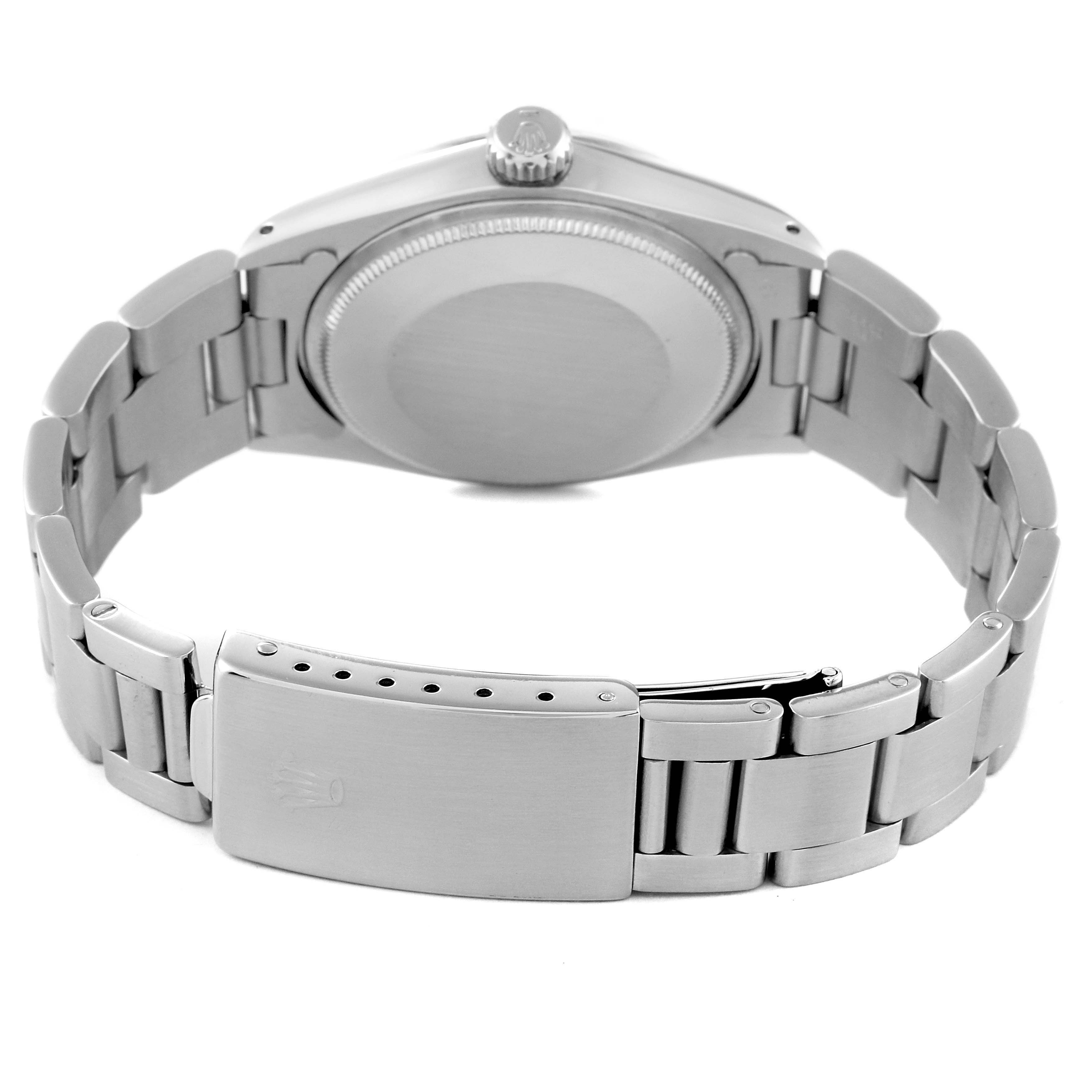 The image shows the back view of a Rolex Vintage Collection 1500 Men's Stainless Steel Black Dial 1500 Men's Stainless Steel Black Dial watch, highlighting the clasp, bracelet, and case back.