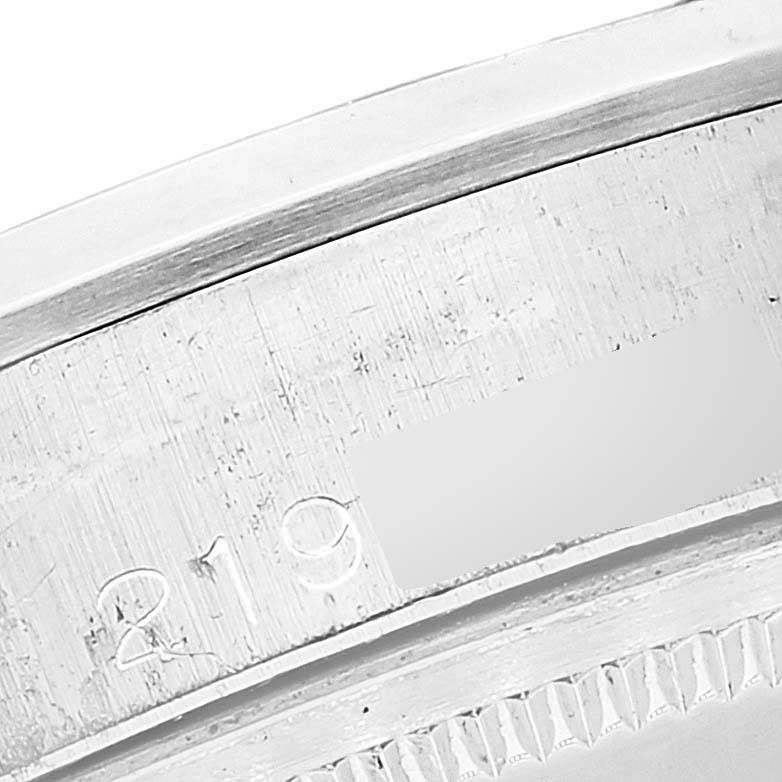 This close-up image shows part of the outer rim and serial number engraving on a Vintage Collection model by Rolex.