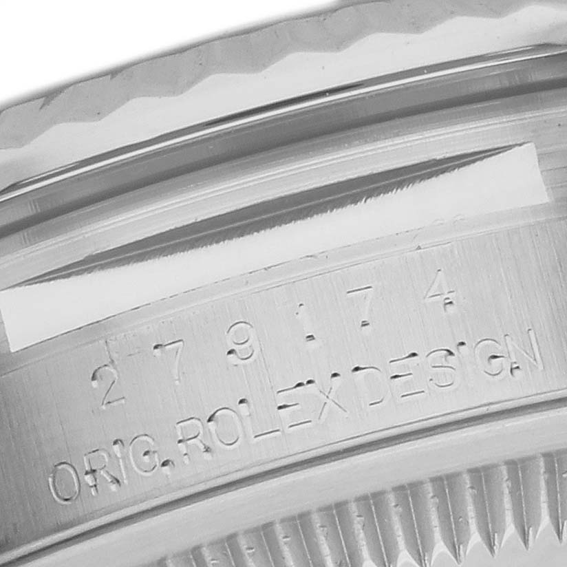 This close-up image shows the serial number and "ORIG. ROLEX DESIGN" engraving on a Rolex Datejust 279174 Women's Stainless Steel Silver Dial 279174 Women's Stainless Steel Silver Dial model.