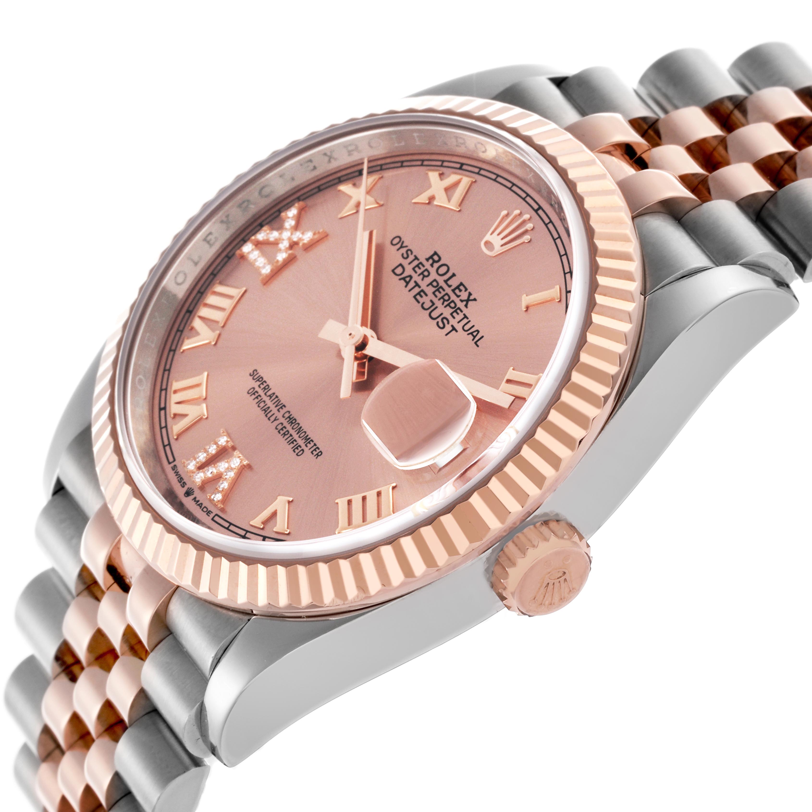 The Rolex Datejust 126231 Men's Steel and Gold (two tone) Pink Dial 126231 Men's Steel and Gold (two tone) Pink Dial watch is shown at an angle highlighting the dial, fluted bezel, crown, and jubilee bracelet.