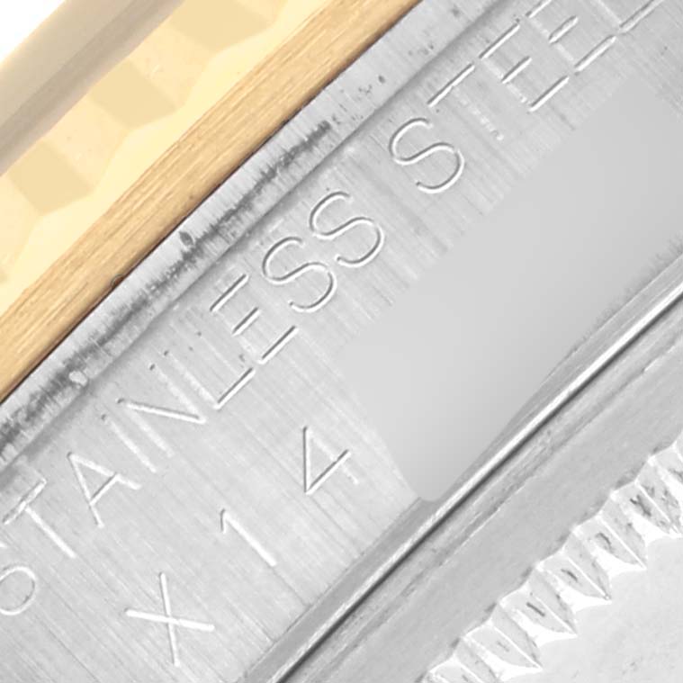 The image shows a close-up of the side engraving on a Rolex Datejust 16233 Men's Steel and Gold (two tone) Black Dial 16233 Men's Steel and Gold (two tone) Black Dial, highlighting "STAINLESS STEEL."