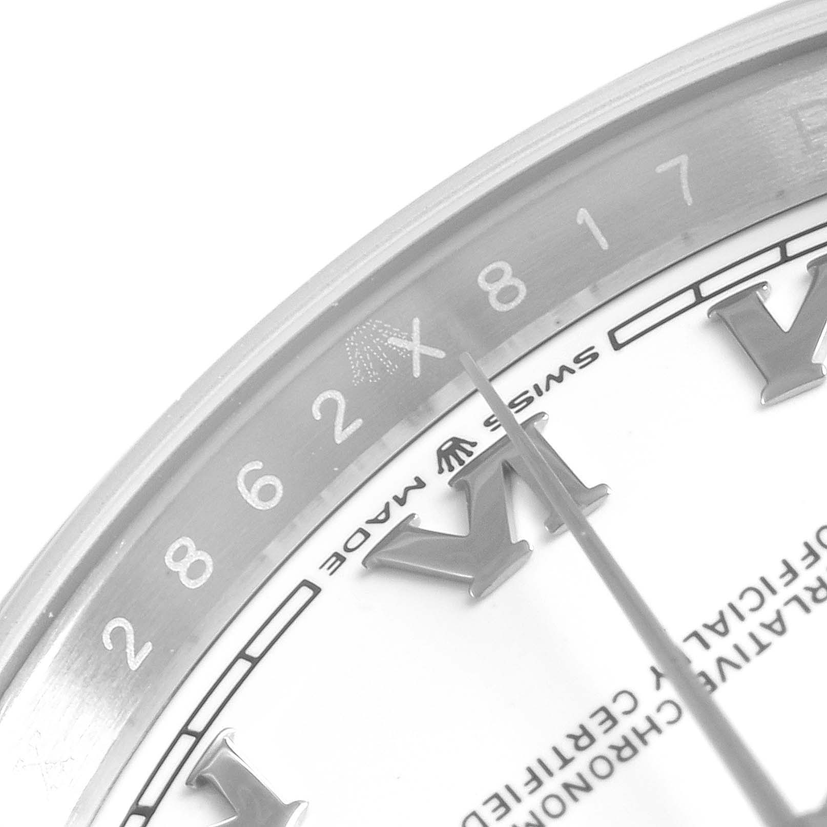 The image shows a close-up of the dial and bezel of a Rolex Datejust 126200 Men's Stainless Steel White Dial 126200 Men's Stainless Steel White Dial watch, highlighting the Roman numeral hour markers and partial minute track.