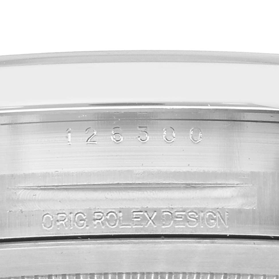 This is a close-up view of the case side of the Rolex Datejust 41 126300 Men's Stainless Steel White Dial 126300 Men's Stainless Steel White Dial, showing the engraved model number and "Orig Rolex Design" inscription.