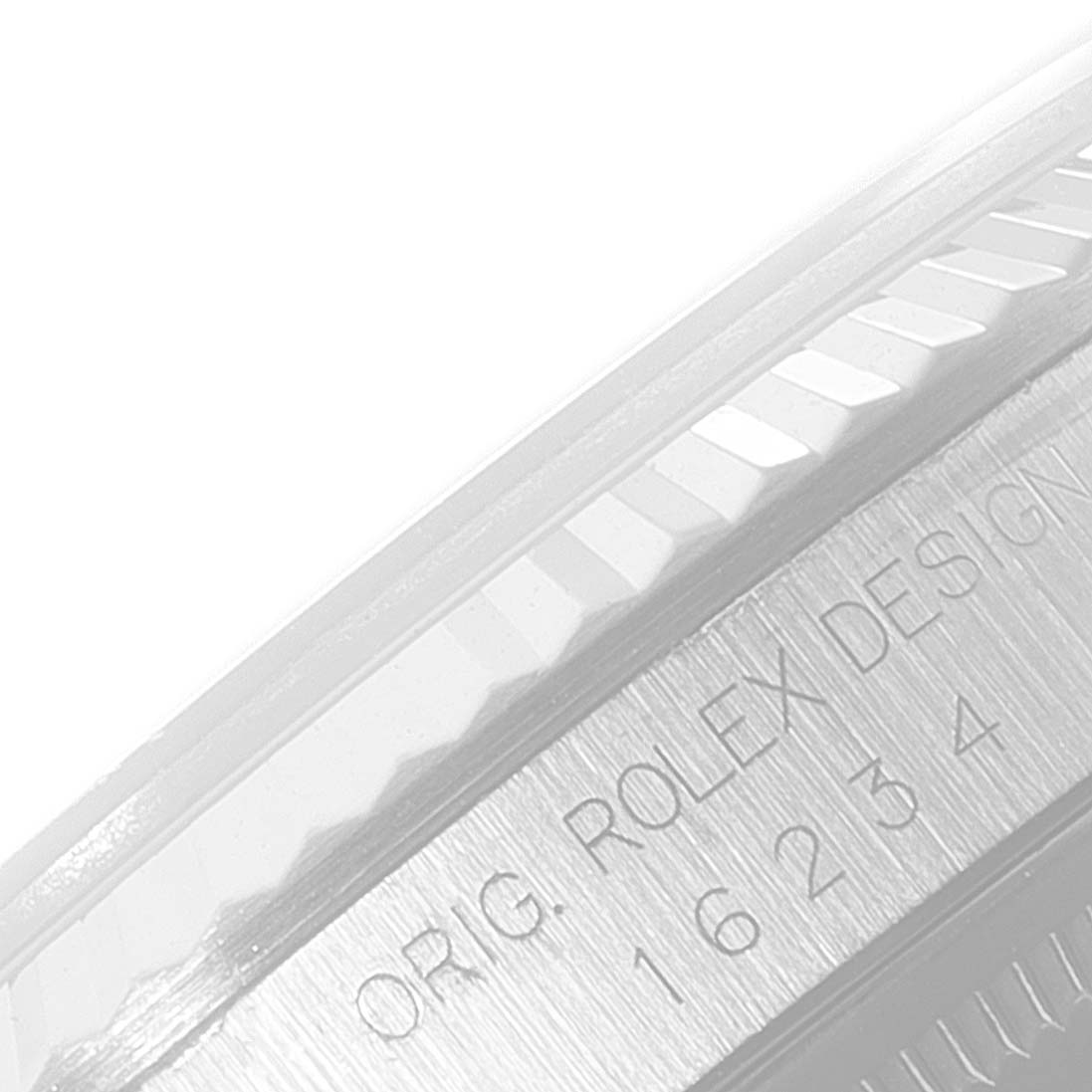 This image shows a close-up of the case side of a Rolex Datejust 16234 Men's Stainless Steel Blue Dial 16234 Men's Stainless Steel Blue Dial, highlighting the model number and original Rolex design inscription.