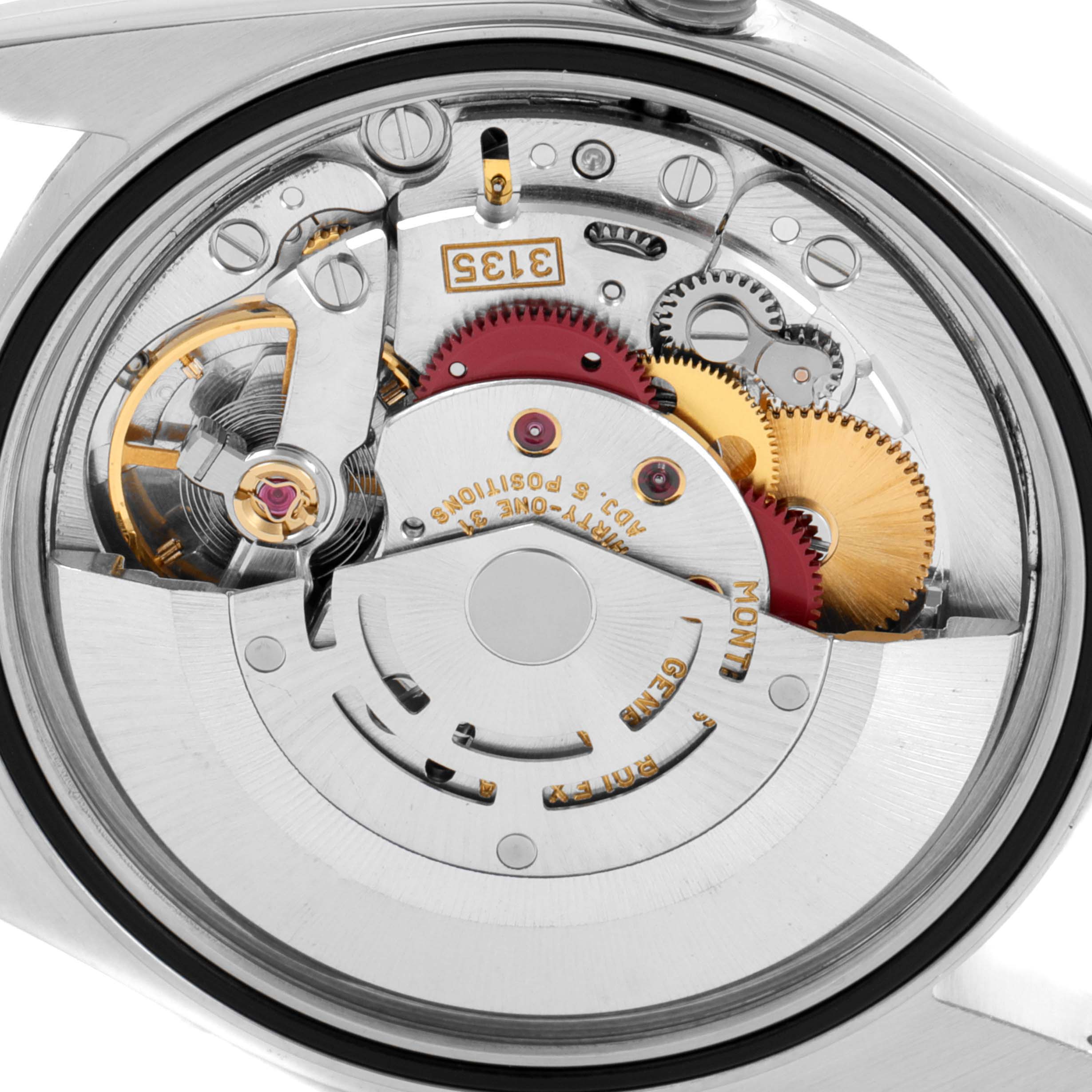 The image shows the back view of the Rolex Datejust 16234 Men's Stainless Steel Blue Dial 16234 Men's Stainless Steel Blue Dial movement, displaying gears and mechanical components.