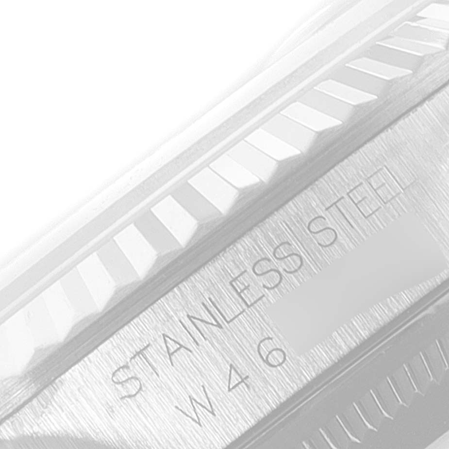 This close-up image shows the bezel and part of the case back of a stainless steel Rolex Datejust 16234 Men's Stainless Steel Blue Dial 16234 Men's Stainless Steel Blue Dial watch.