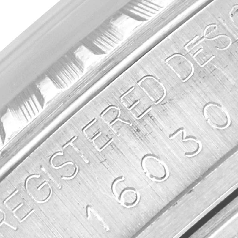 The image shows a close-up of the engraved side of a Rolex Datejust 16030 Men's Stainless Steel Silver Dial 16030 Men's Stainless Steel Silver Dial watch case.