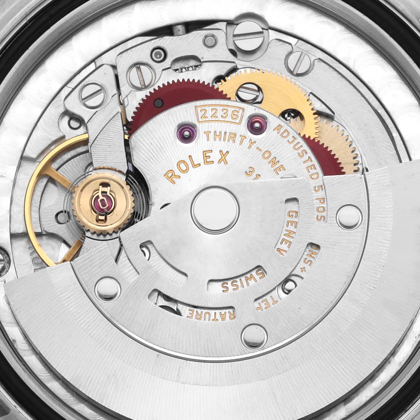 This is a close-up view of the movement inside a Rolex Mid-Size 278274 Women's Stainless Steel Silver Dial 278274 Women's Stainless Steel Silver Dial watch, showing gears and mechanisms.