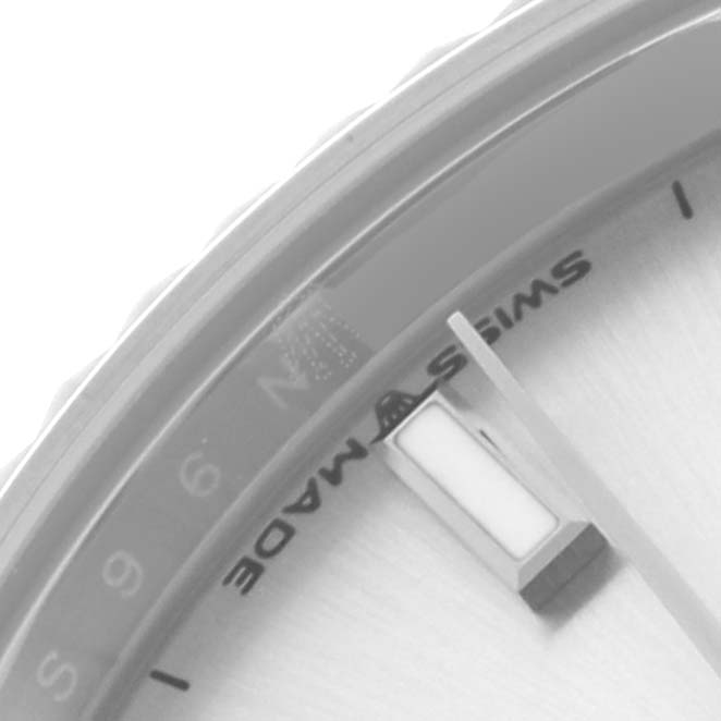 The image shows a partial dial of the Rolex Mid-Size 278274 Women's Stainless Steel Silver Dial 278274 Women's Stainless Steel Silver Dial watch, focusing on the "SWISS MADE" text and an hour marker.