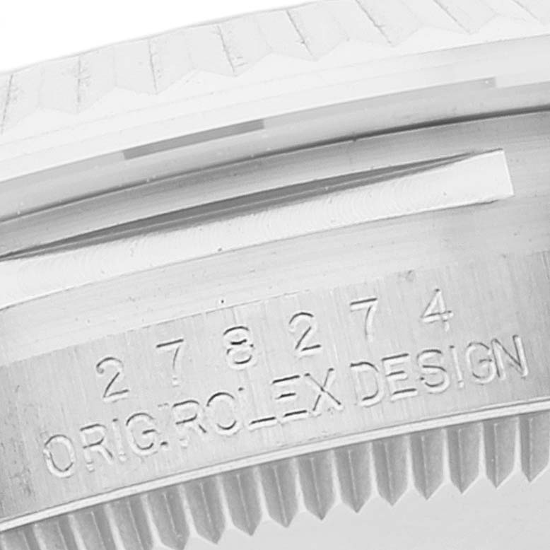 The image shows a close-up of the bezel and the case side of a Mid-Size Rolex watch, displaying the serial number and "ORIG ROLEX DESIGN."