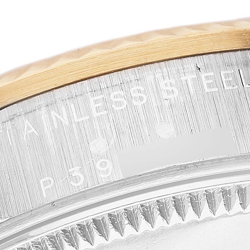 A close-up of the side portion of a Rolex Mid-Size 78273 Women's Steel and Gold (two tone) Mother of Pearl Dial 78273 Women's Steel and Gold (two tone) Mother of Pearl Dial watch highlighting the stainless steel case and part of the bezel.