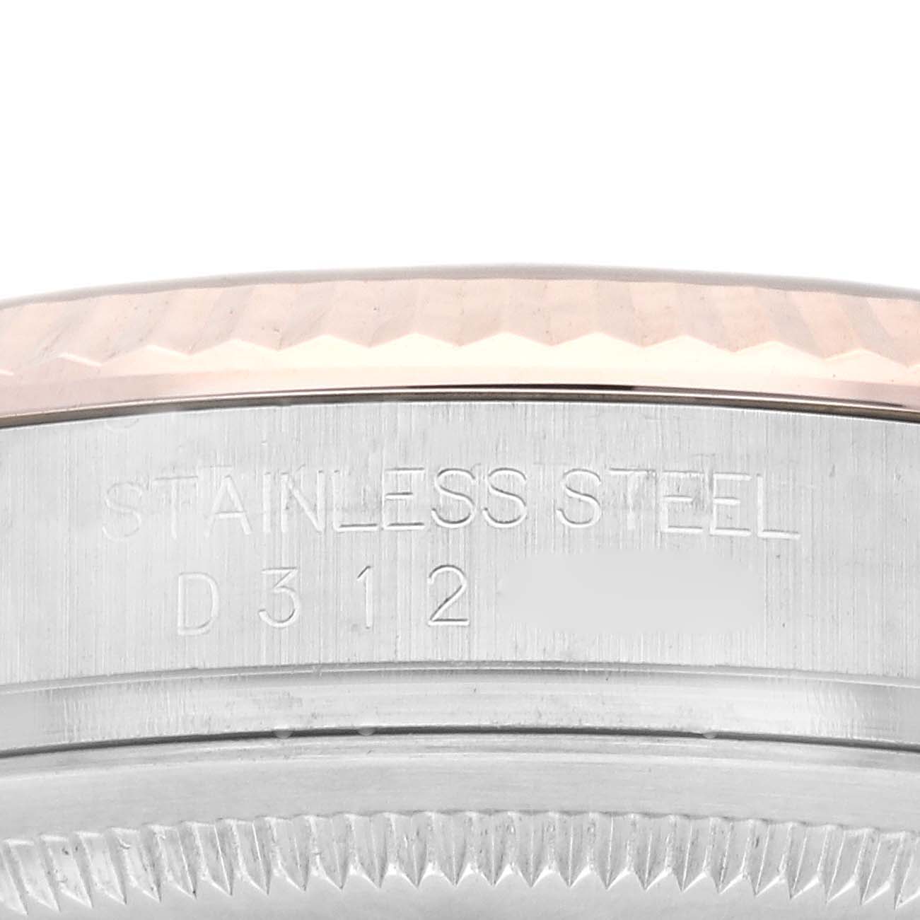 The image shows a close-up of the bezel and engraved stainless steel part of a Rolex Datejust 116231 Men's Steel and Gold (two tone) Pink Dial 116231 Men's Steel and Gold (two tone) Pink Dial watch.
