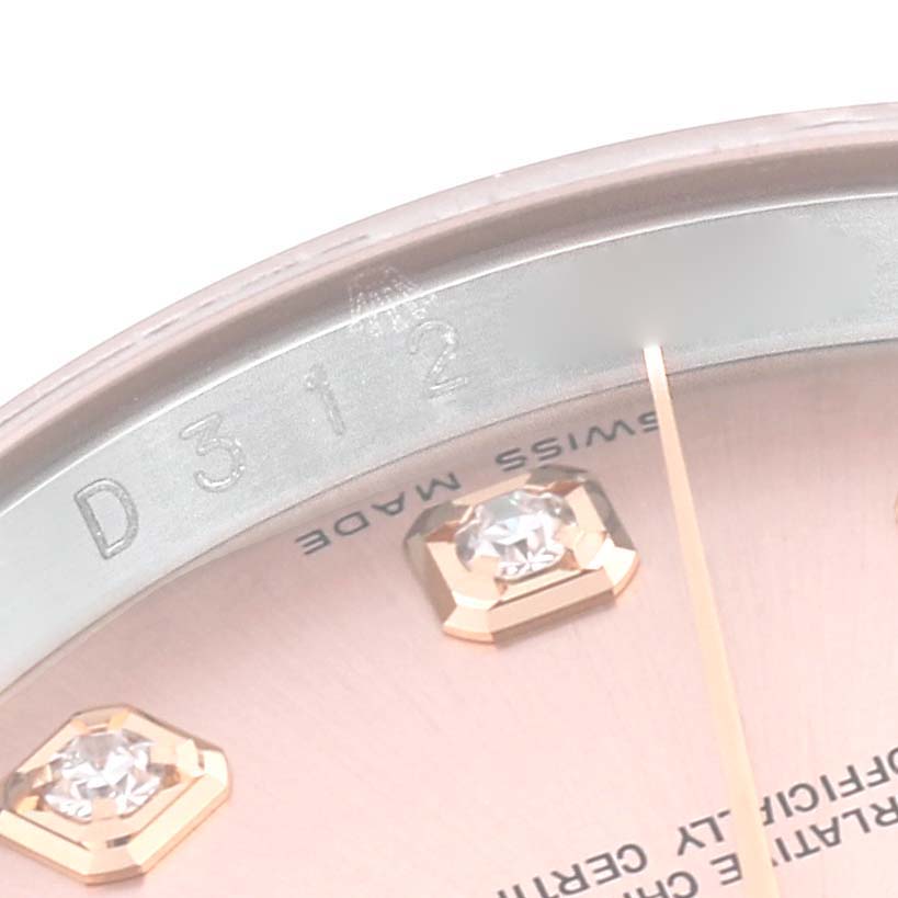 This close-up angle shows the rim, part of the dial, and jewel markers of the Rolex Datejust 116231 Men's Steel and Gold (two tone) Pink Dial 116231 Men's Steel and Gold (two tone) Pink Dial watch.
