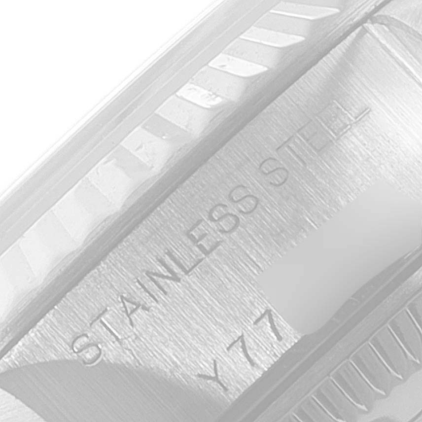 The image shows a close-up of the case edge and part of the bezel of a Rolex Datejust 79174 Women's Stainless Steel Black Dial 79174 Women's Stainless Steel Black Dial watch, highlighting "STAINLESS STEEL" engraving.