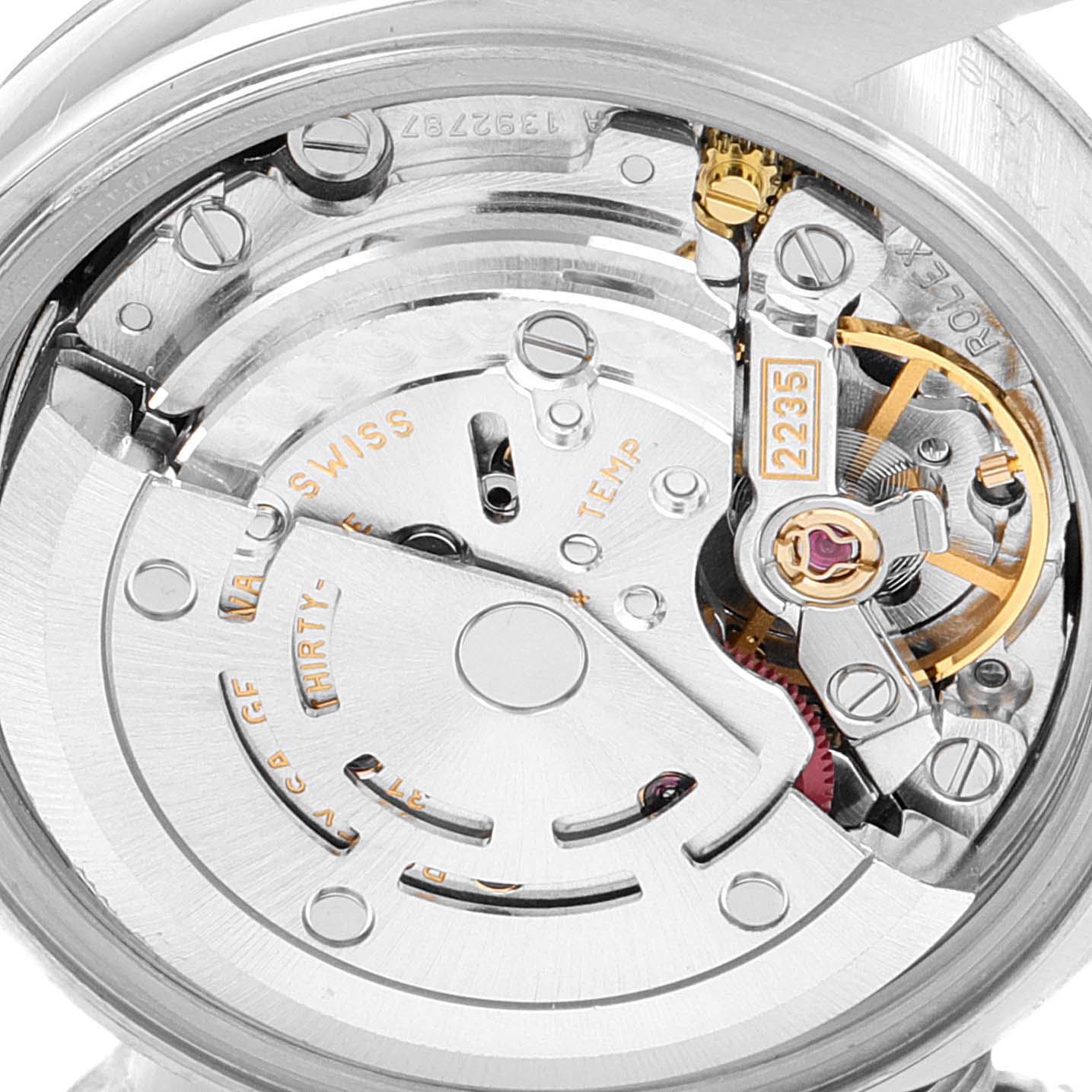 The image shows the internal mechanism of the Rolex Datejust 79174 Women's Stainless Steel Black Dial 79174 Women's Stainless Steel Black Dial watch, focusing on the movement components from a close-up angle.