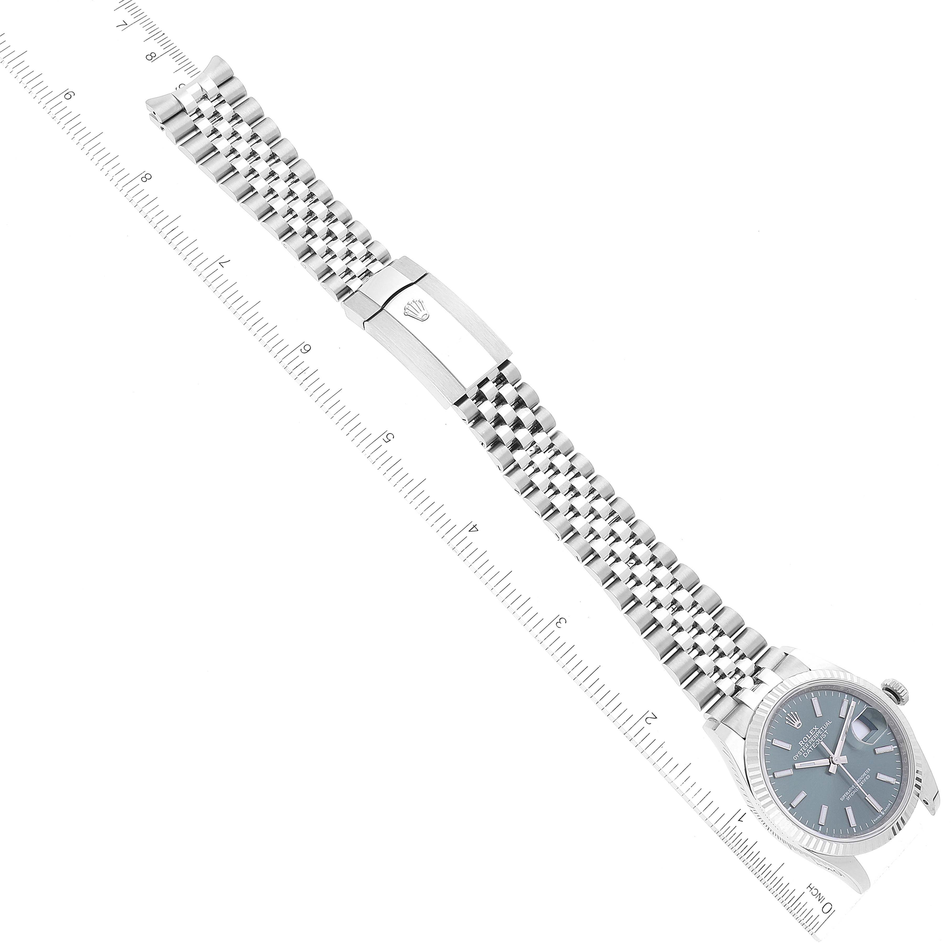 The image shows a top-down view of a Rolex Datejust 126234 Men's Stainless Steel Green Dial 126234 Men's Stainless Steel Green Dial watch, highlighting its bracelet and clasp.