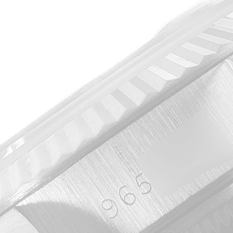 This close-up image shows the fluted bezel and case side of a Rolex Datejust 69174 Women
s Stainless Steel Silver Dial 69174 Women
s Stainless Steel Silver Dial watch.