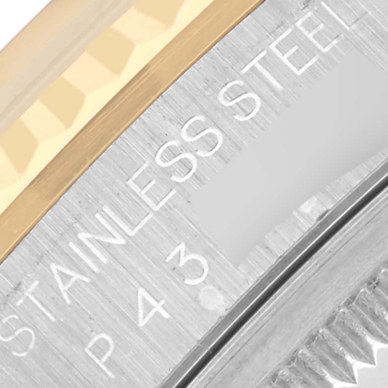 The image shows a close-up angle of the bezel and part of the case back of the Rolex Datejust 16233 Men's Steel and Gold (two tone) Black Dial 16233 Men's Steel and Gold (two tone) Black Dial, highlighting the stainless steel marking.