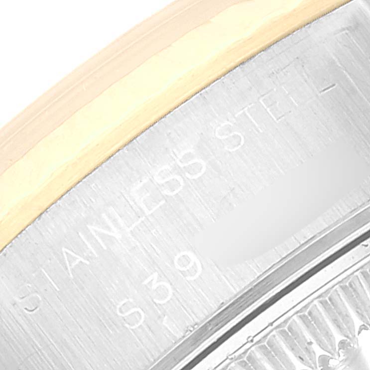 This close-up image shows the edge of the case back of a Rolex Datejust 69173 Women's Steel and Gold (two tone) Champagne Dial 69173 Women's Steel and Gold (two tone) Champagne Dial, highlighting the "STAINLESS STEEL" engraving.