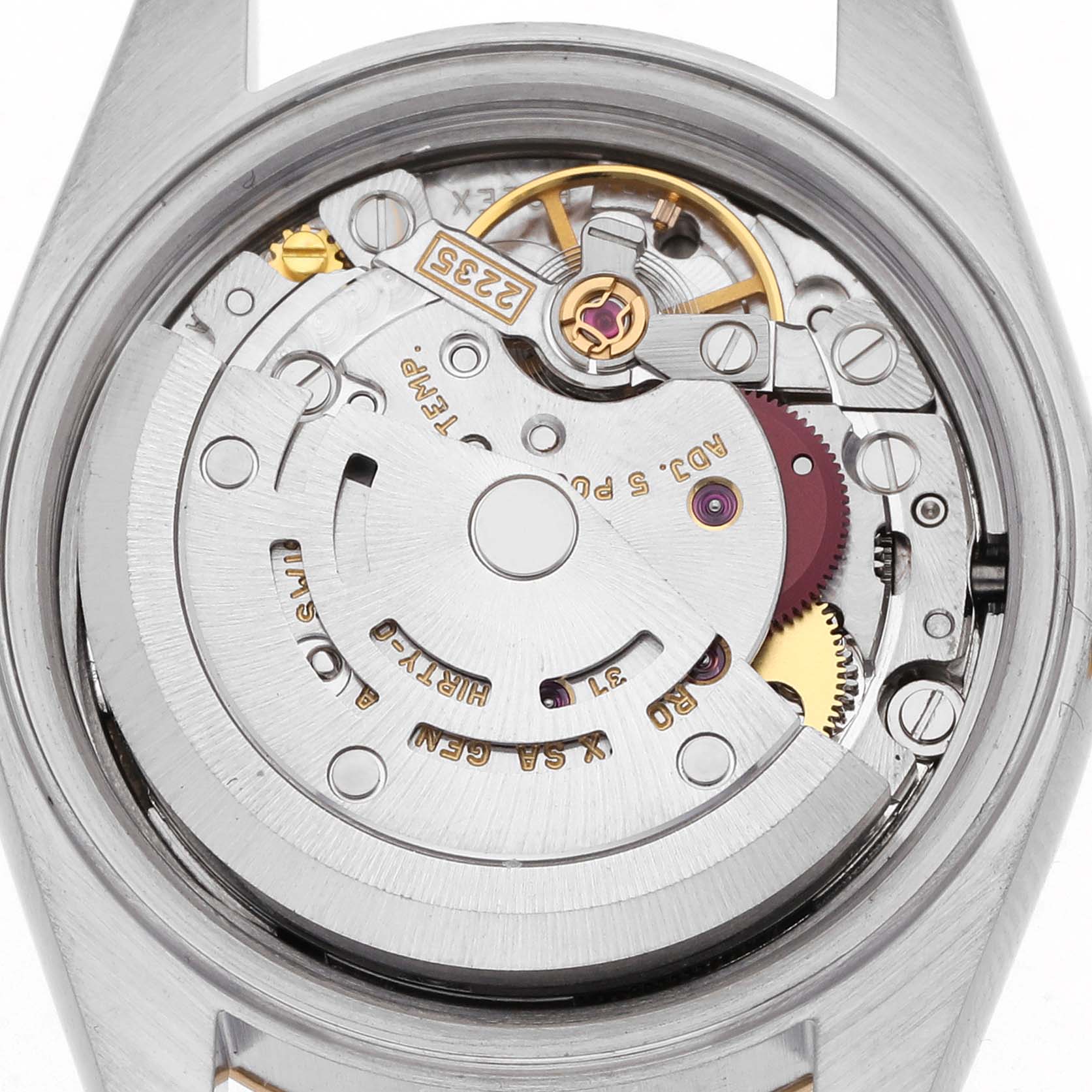 The image shows the movement mechanism of a Rolex Datejust 79173 Women's Steel and Gold (two tone) Champagne Dial 79173 Women's Steel and Gold (two tone) Champagne Dial watch from a top-down angle, highlighting gears and rotor.