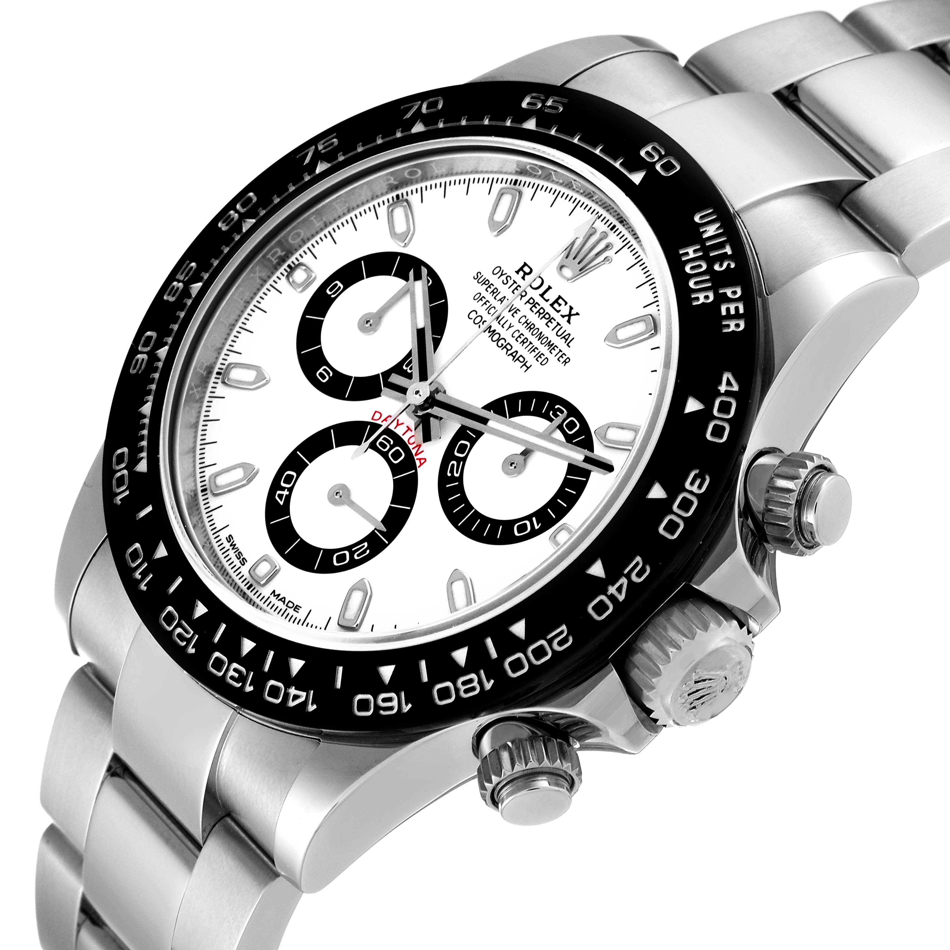 The image shows a close-up of the Rolex Daytona 116500 Men's Stainless Steel White Dial 116500 Men's Stainless Steel White Dial watch, capturing its face, bezel, pushers, and part of the bracelet.