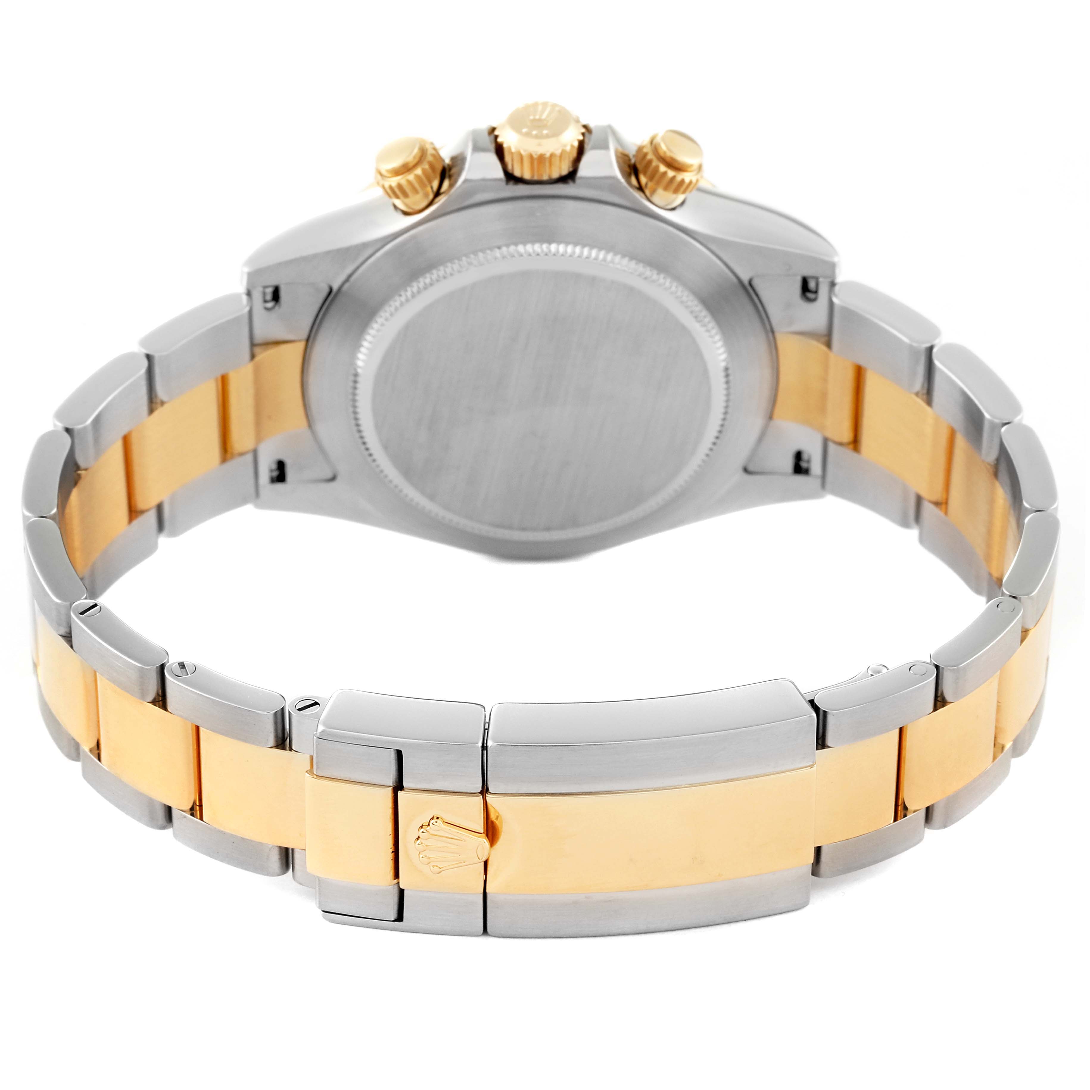 The image shows the back of the Rolex Daytona 116523 Men's Steel and Gold (two tone) Mother of Pearl Dial 116523 Men's Steel and Gold (two tone) Mother of Pearl Dial watch, focusing on the stainless steel and gold bracelet and the case back.