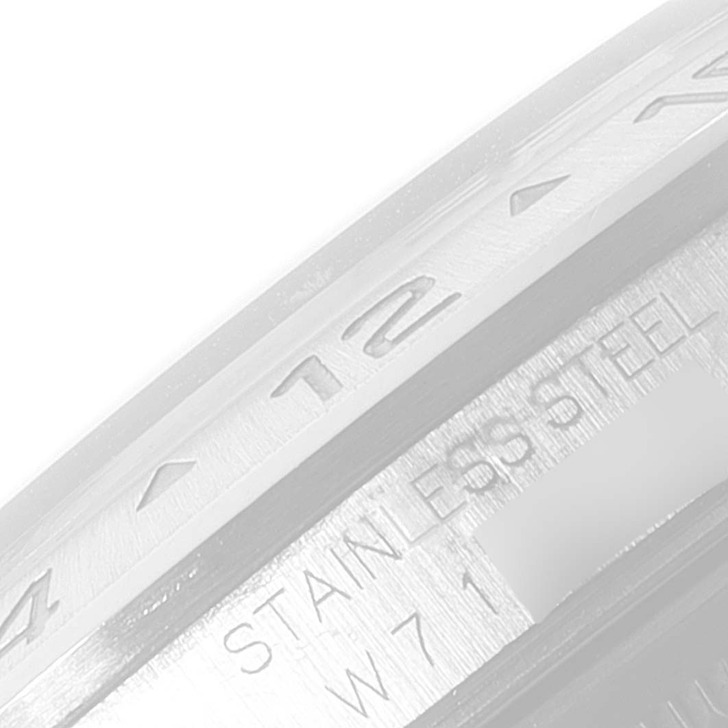 This image shows a close-up of the stainless steel bezel and markings of the Rolex Explorer 16570 Men's Stainless Steel Black Dial 16570 Men's Stainless Steel Black Dial watch.