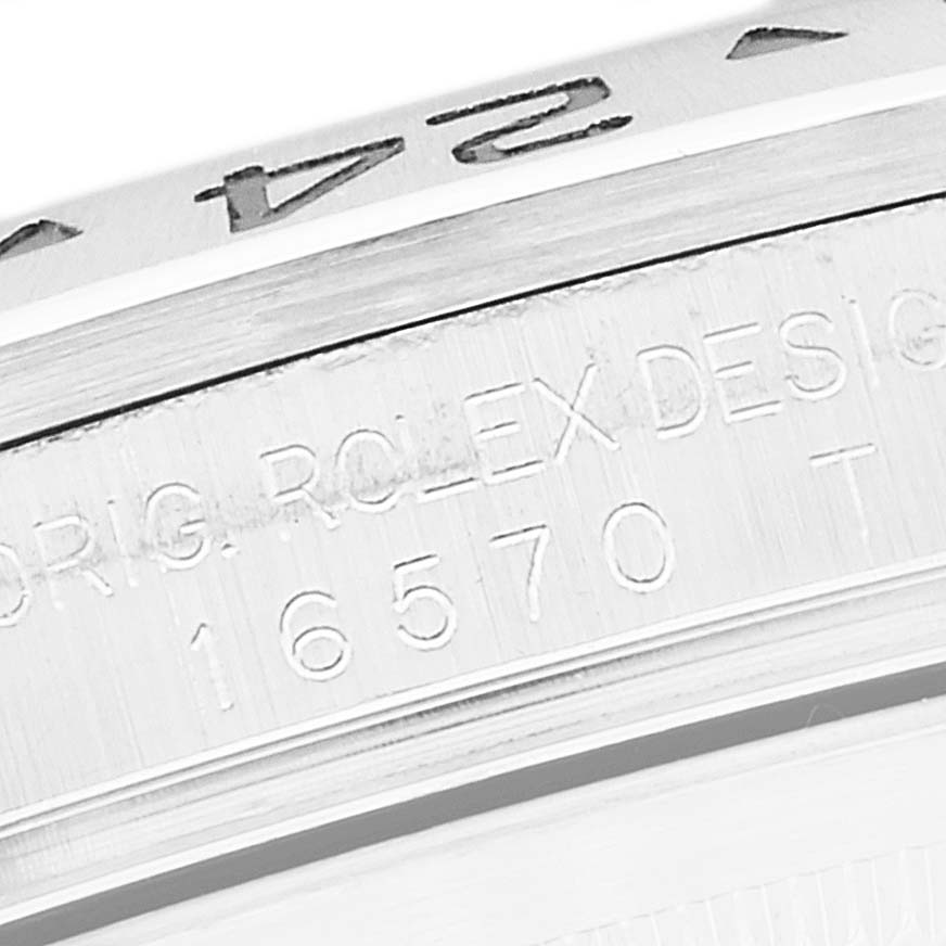 This close-up image shows the bezel and engraving of the model number "16570" on a Rolex Explorer 16570 Men
s Stainless Steel Black Dial 16570 Men
s Stainless Steel Black Dial watch.
