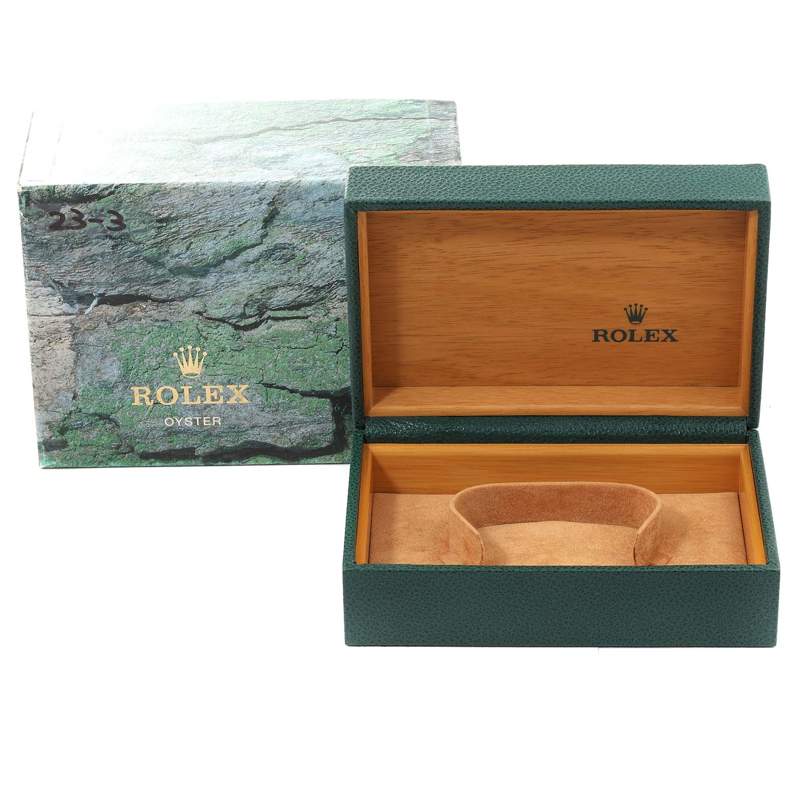 This shows an open Rolex watch box with a green exterior and wooden interior, and its outer sleeve for the Explorer model.
