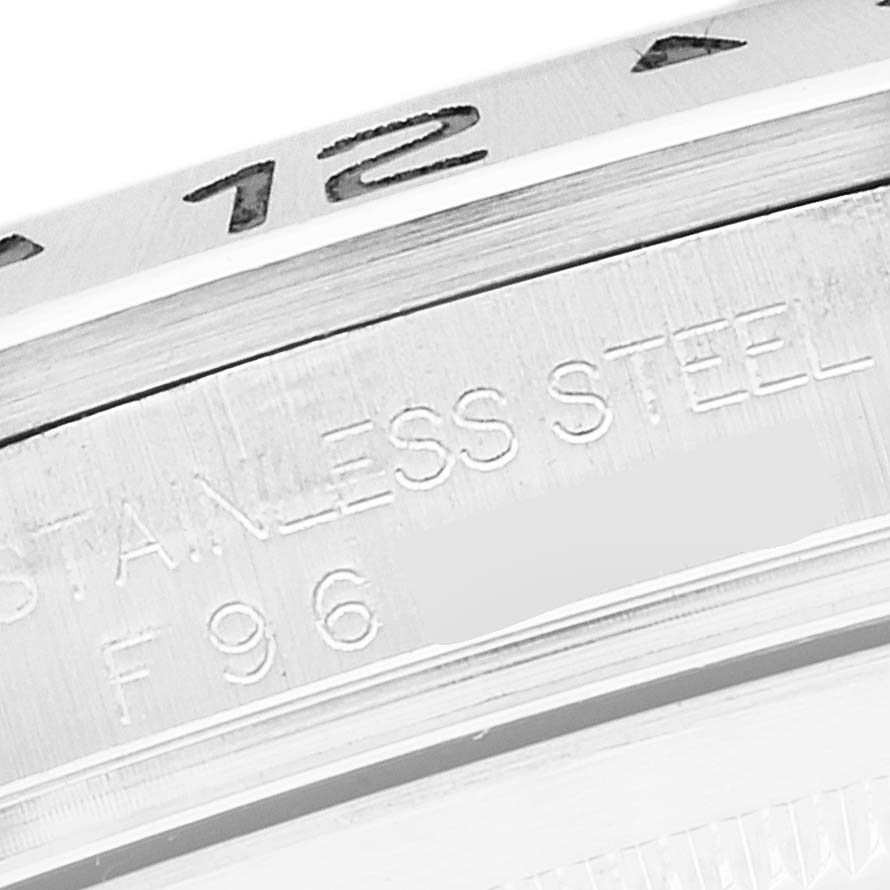 The image shows a close-up of the side engravings on the bezel and case back of a Rolex Explorer 16570 Men
s Stainless Steel Black Dial 16570 Men
s Stainless Steel Black Dial watch.