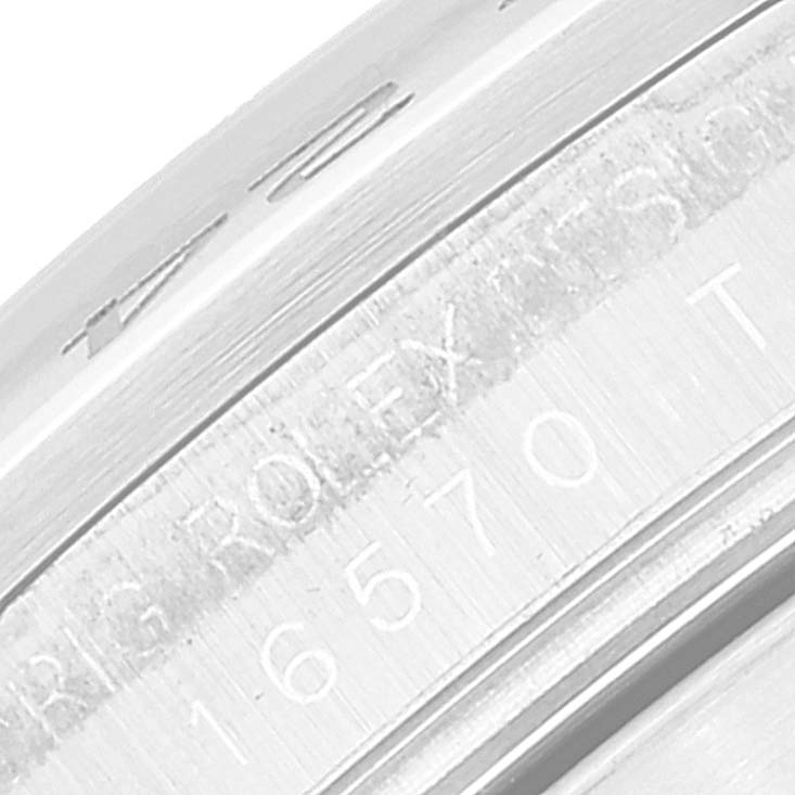 This image shows a close-up of the inner bezel and engraving on a Rolex Explorer 16570 Men
s Stainless Steel Black Dial 16570 Men
s Stainless Steel Black Dial model.