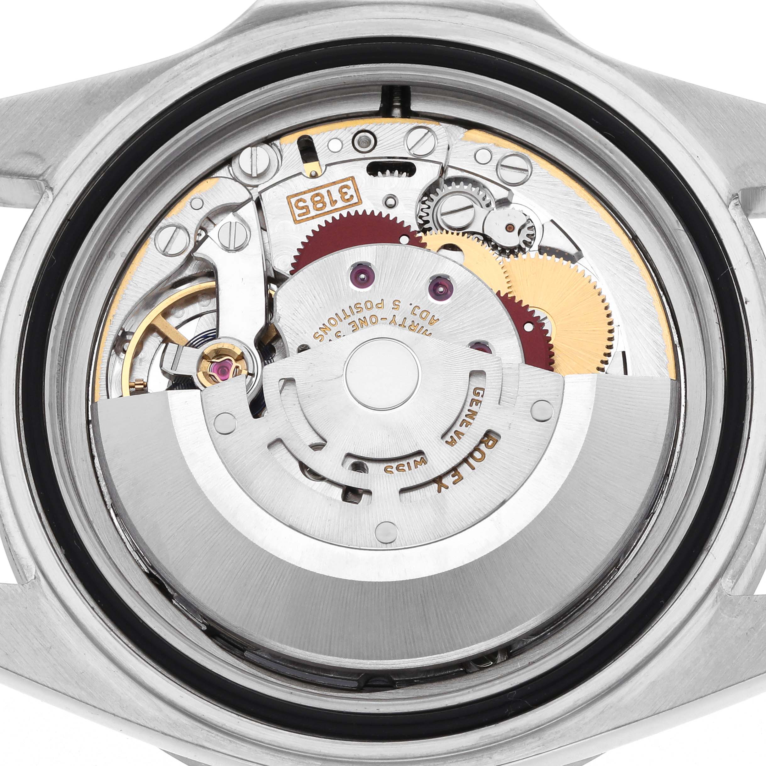 The image shows the internal movement of a Rolex Explorer 16570 Men's Stainless Steel White Dial 16570 Men's Stainless Steel White Dial watch from a rear angle, highlighting gears and the rotor.