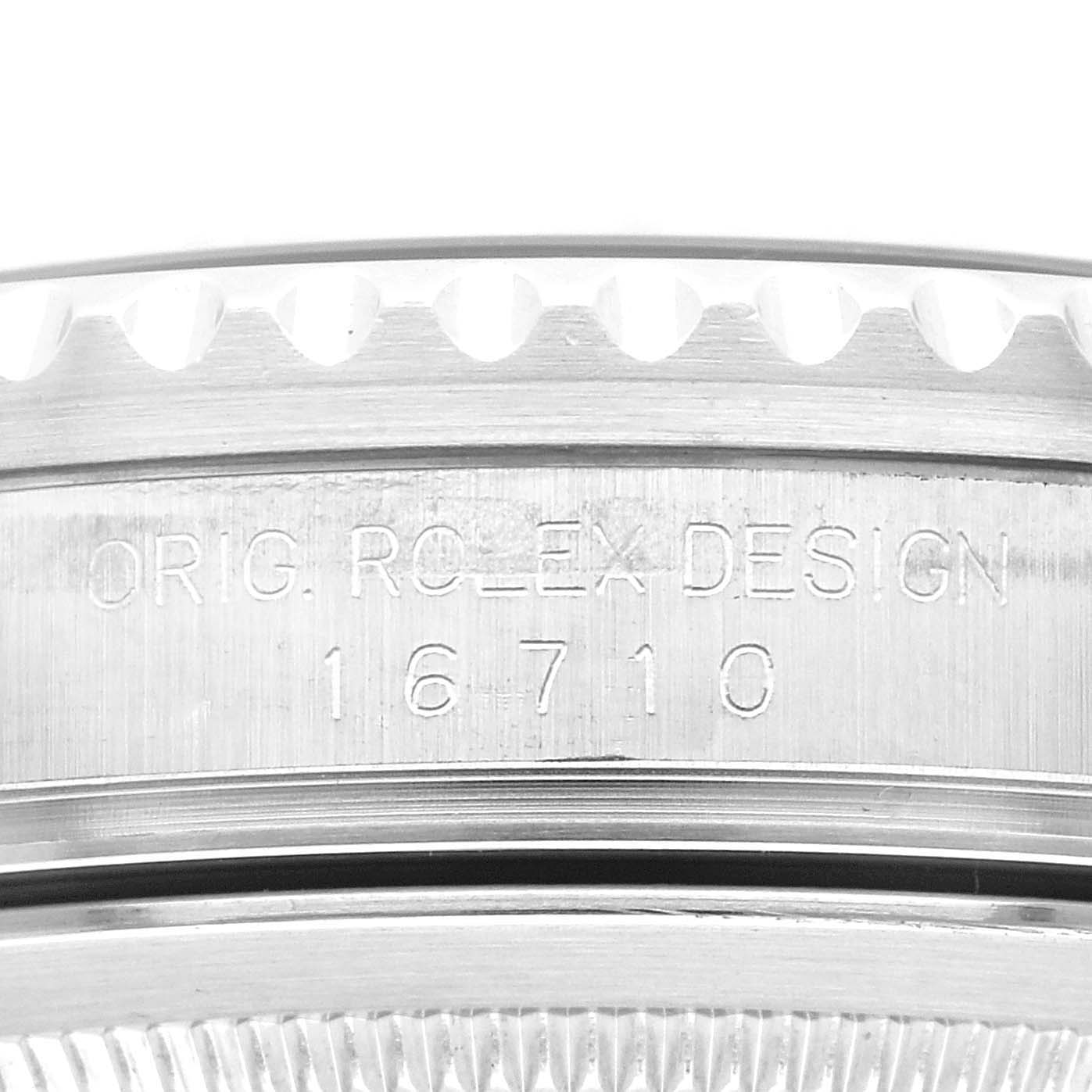 This close-up angle shows the side of the case, including the model number and "ORIG. ROLEX DESIGN" engraving, of a Rolex GMT-Master 16710 Men's Stainless Steel Black Dial 16710 Men's Stainless Steel Black Dial 16710.
