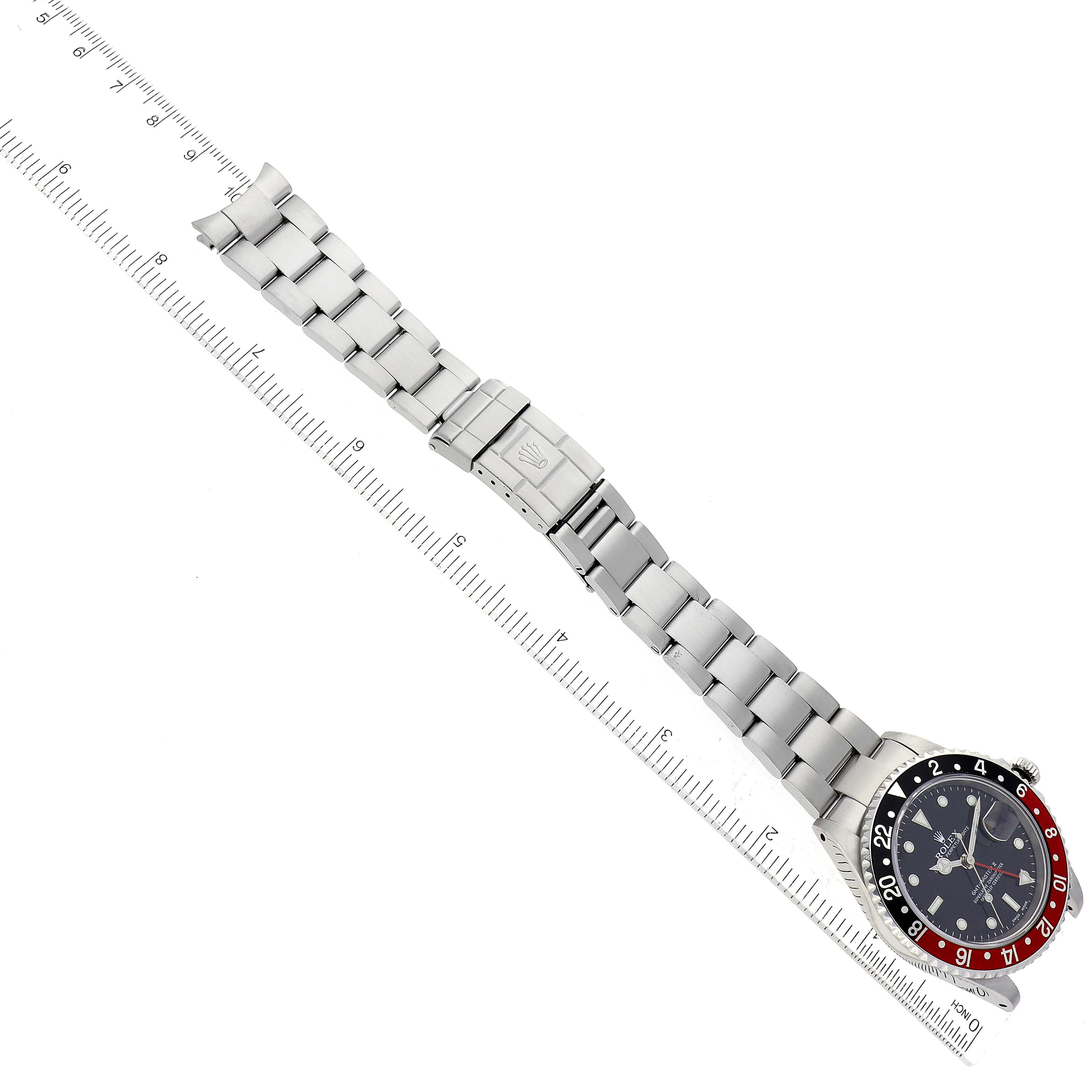 The image shows a top-down view of a Rolex GMT-Master 16710 Men's Stainless Steel Black Dial 16710 Men's Stainless Steel Black Dial watch, highlighting the dial, bezel, and entire bracelet.