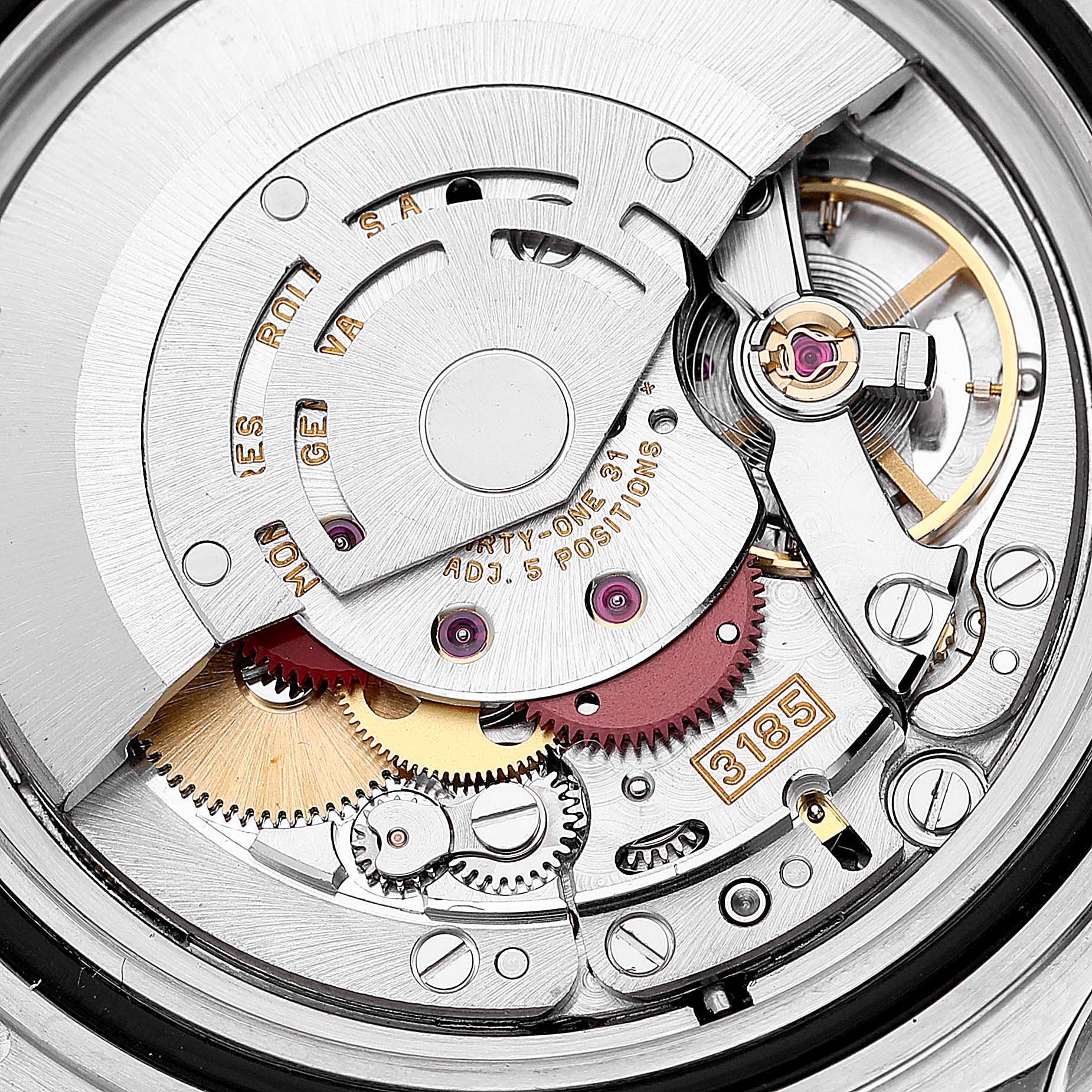 Close-up view of the movement mechanism of a Rolex GMT-Master 16710 Men
s Stainless Steel Black Dial 16710 Men
s Stainless Steel Black Dial, showcasing gears, balance wheel, and rotor.