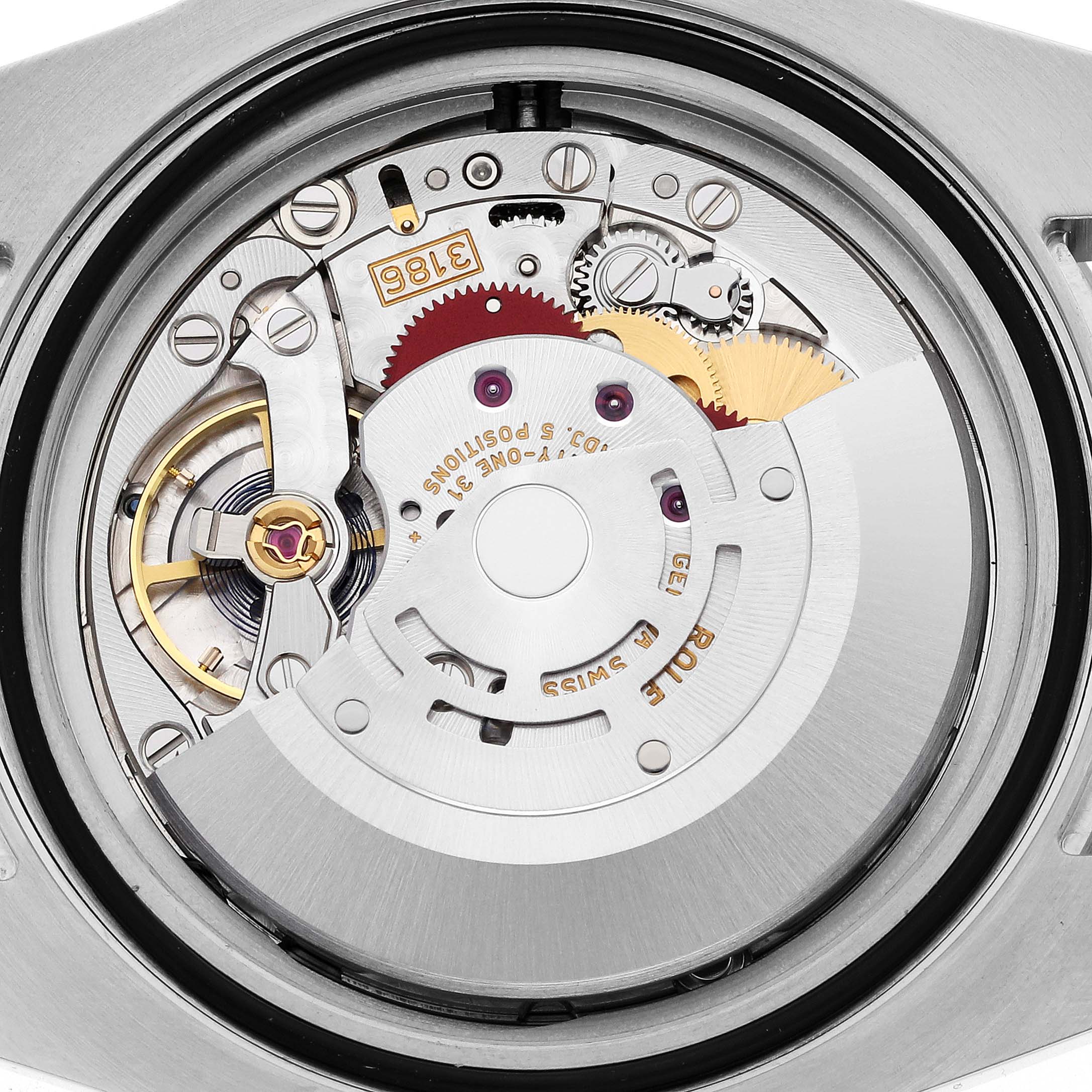 This image shows the intricate internal movement mechanism of a Rolex GMT-Master 116713 Men
s Steel and Gold (two tone) Black Dial 116713 Men
s Steel and Gold (two tone) Black Dial watch.