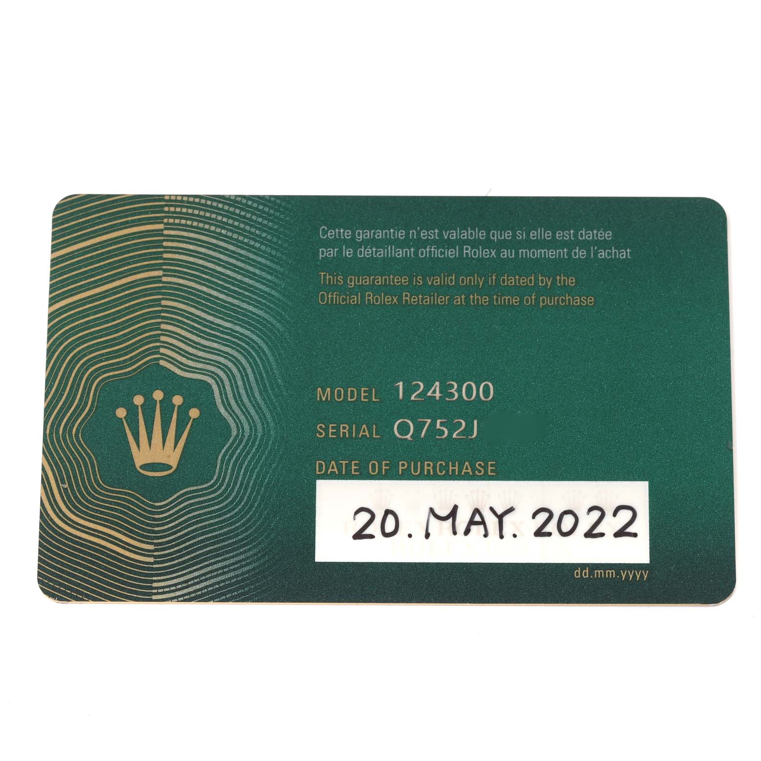 The image shows the warranty card for a Rolex Oyster Perpetual 124300 Men
s Stainless Steel Black Dial 124300 Men
s Stainless Steel Black Dial model 124300, indicating the serial number and date of purchase.