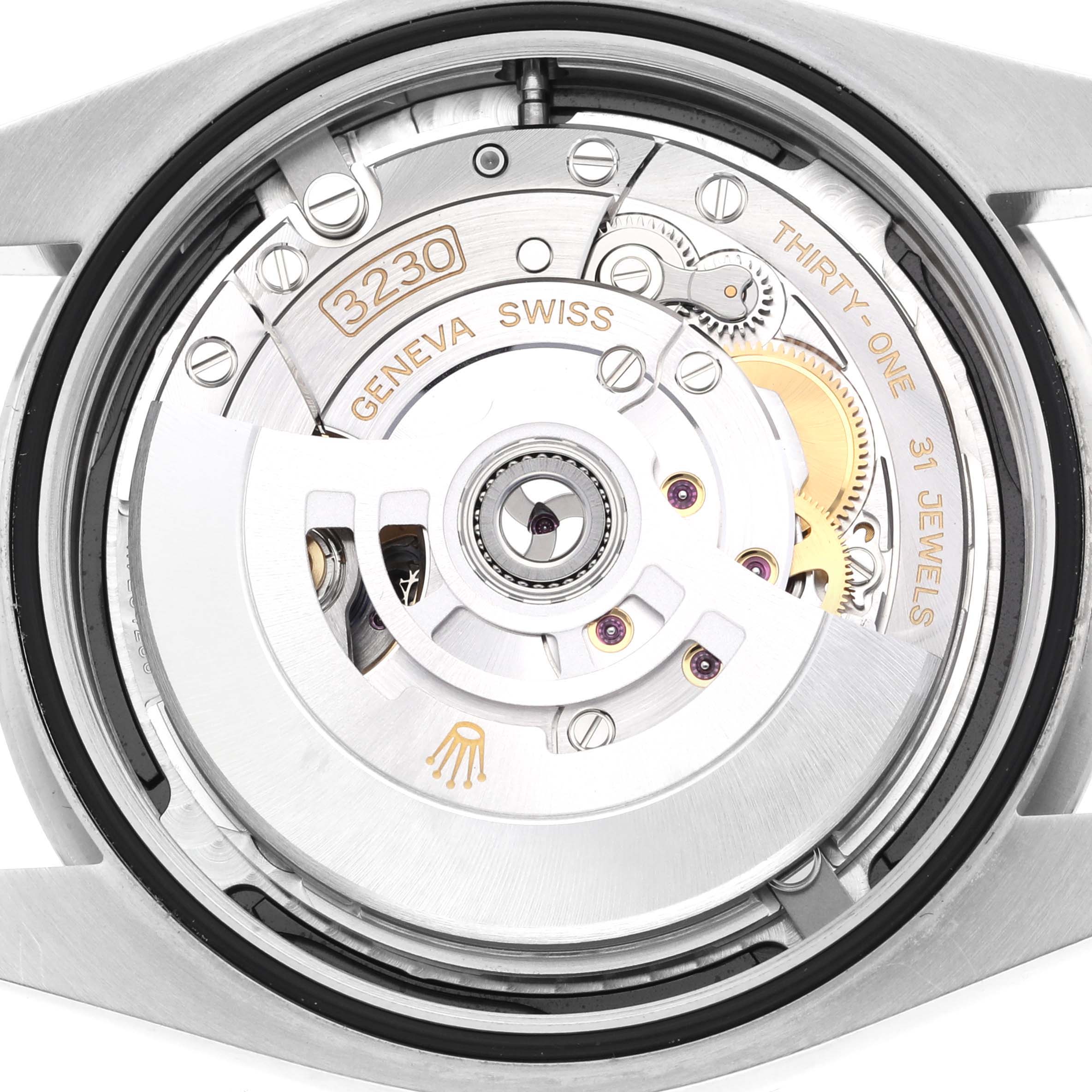The image shows the backside and internal movement of a Rolex Oyster Perpetual 124300 Men
s Stainless Steel Black Dial 124300 Men
s Stainless Steel Black Dial watch, highlighting its mechanism and jewels.