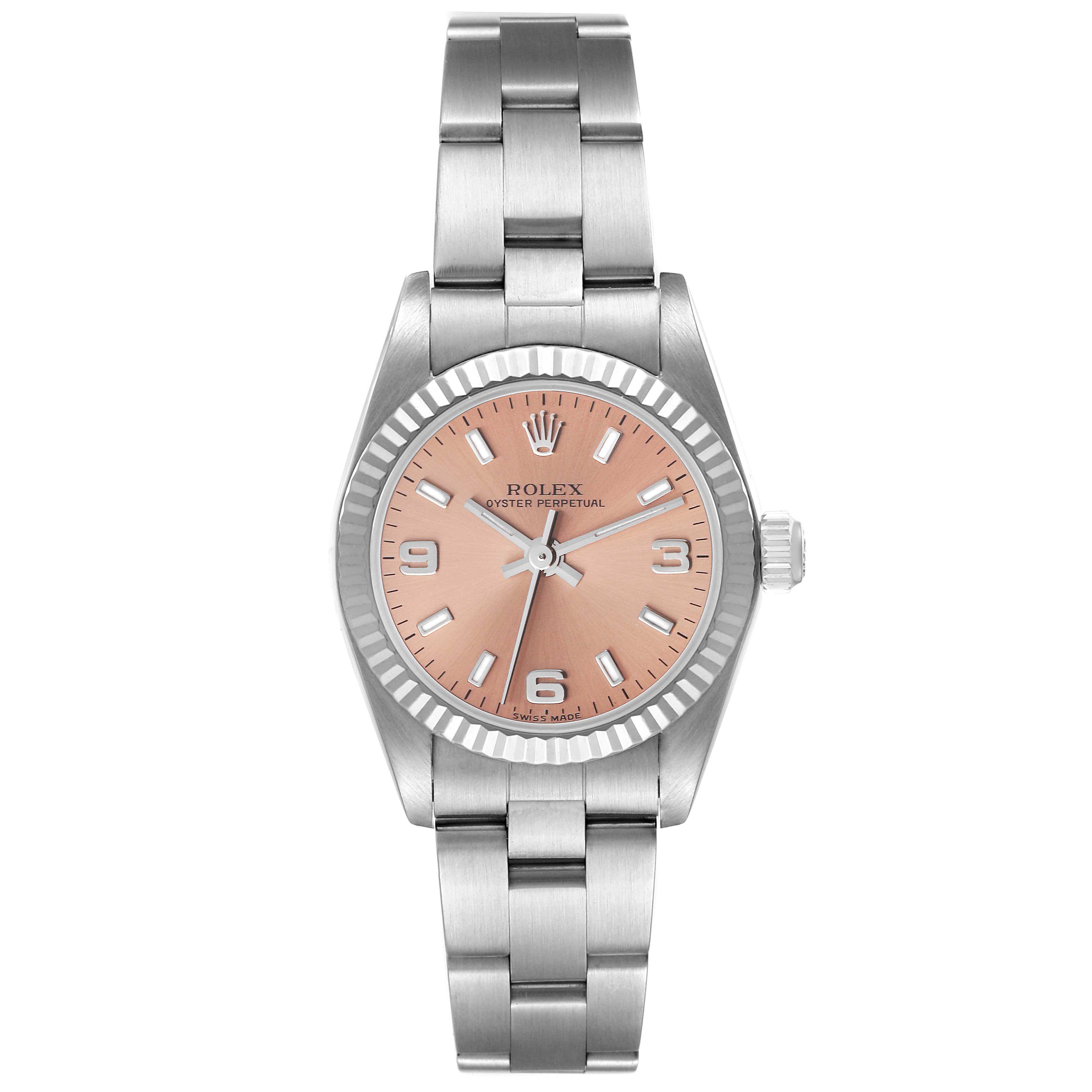 The Rolex Oyster Perpetual 76094 Women
s Stainless Steel Pink Dial 76094 Women
s Stainless Steel Pink Dial watch is shown from a top-down angle, displaying the face, bezel, and bracelet.